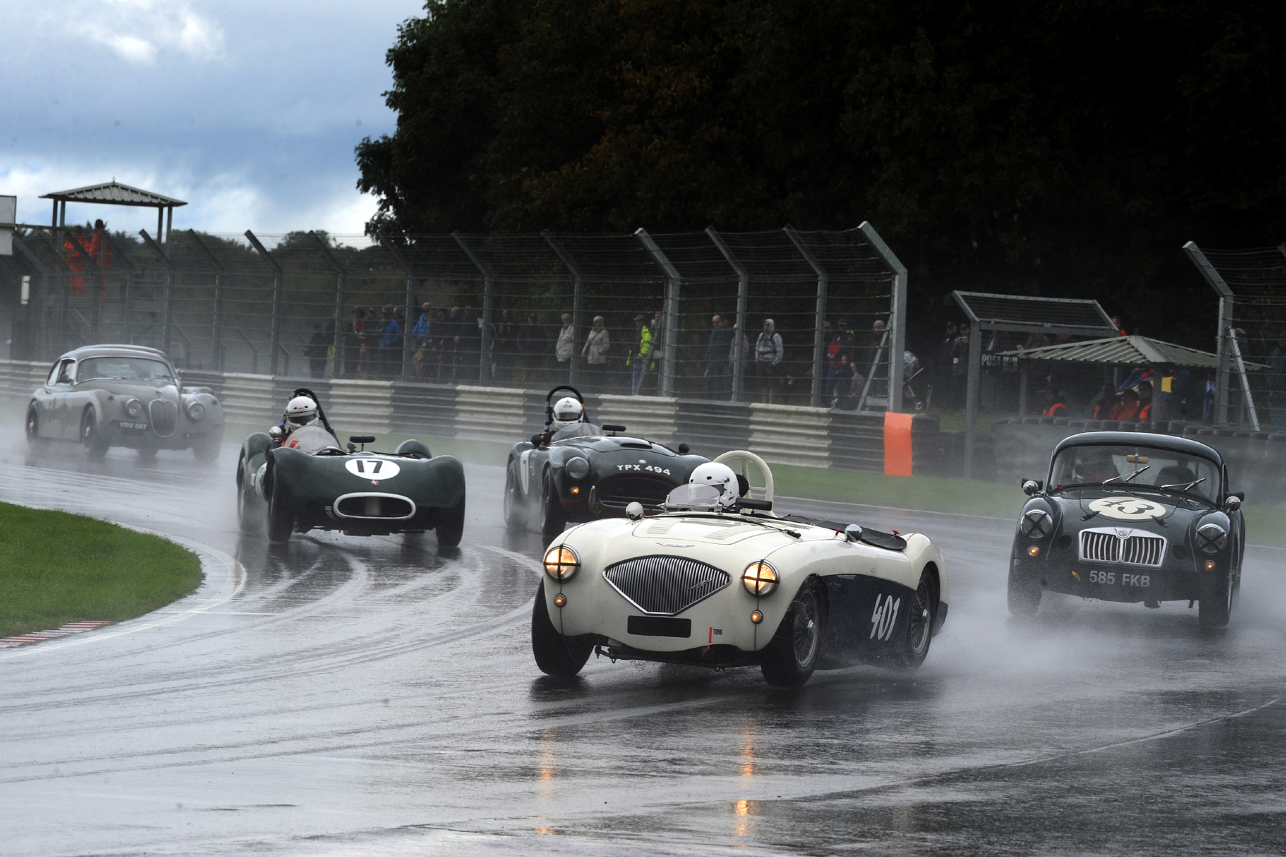 Excellent starts by Jason Harris (401) and Alex Quattlebaum (17) saw them move up several places on the first lap. On their outside respectively are Glenn Tollett in his MGA and Tim Pearce in the AC Ace Bristol. Also in shot is Paul de Havilland in his Jaguar XK150S. Photo - Jeff Bloxham