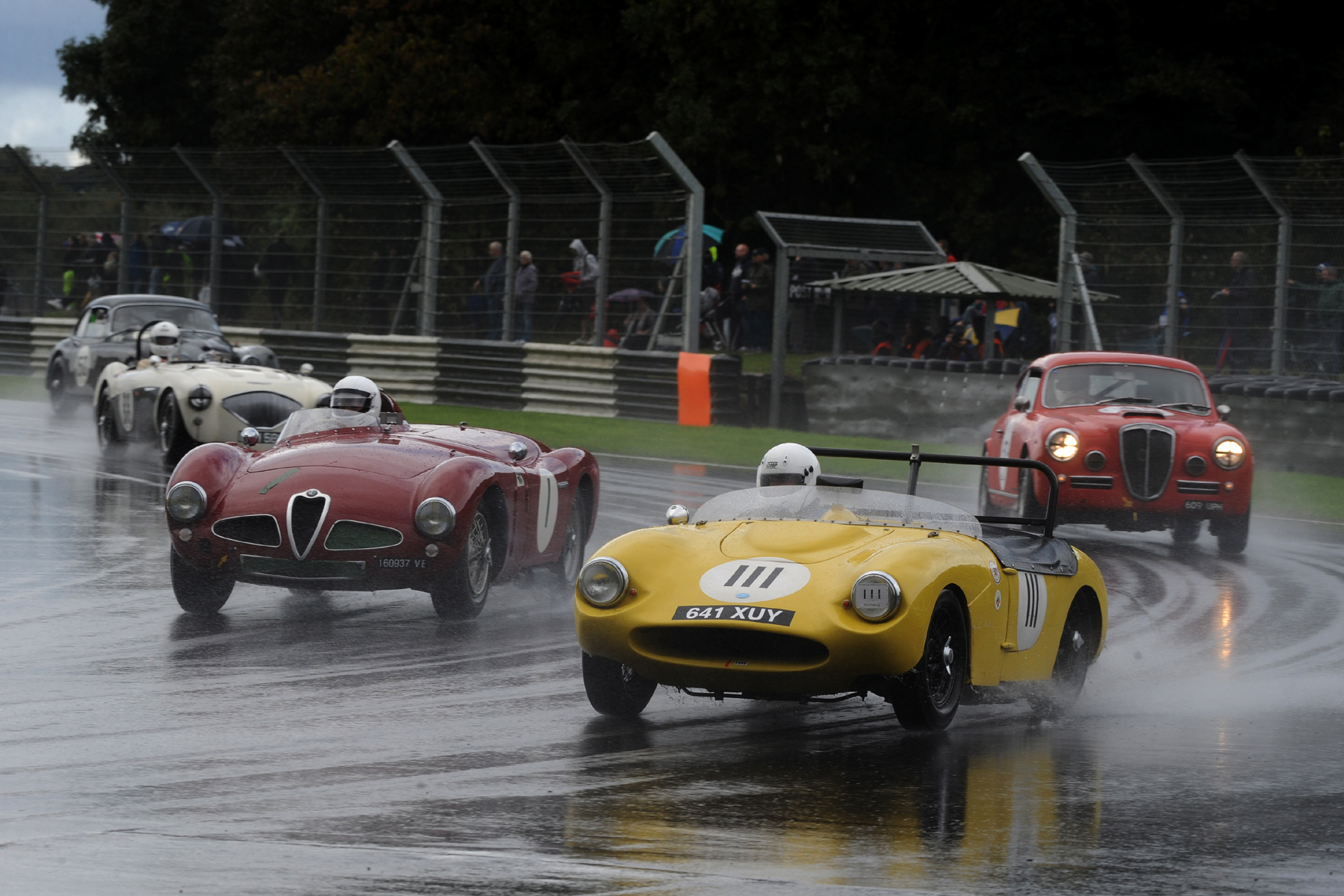Probably the best first lap of all was that of Rob Cobden in the little Fairthorpe Electron making 13 places. Italian classics behind him are Chris Mann's Alfa Romeo Disco Volante, and Jason Kennedy, keeping rather drier in the Lancia Aurelia B20GT. Photo - Jeff Bloxham 