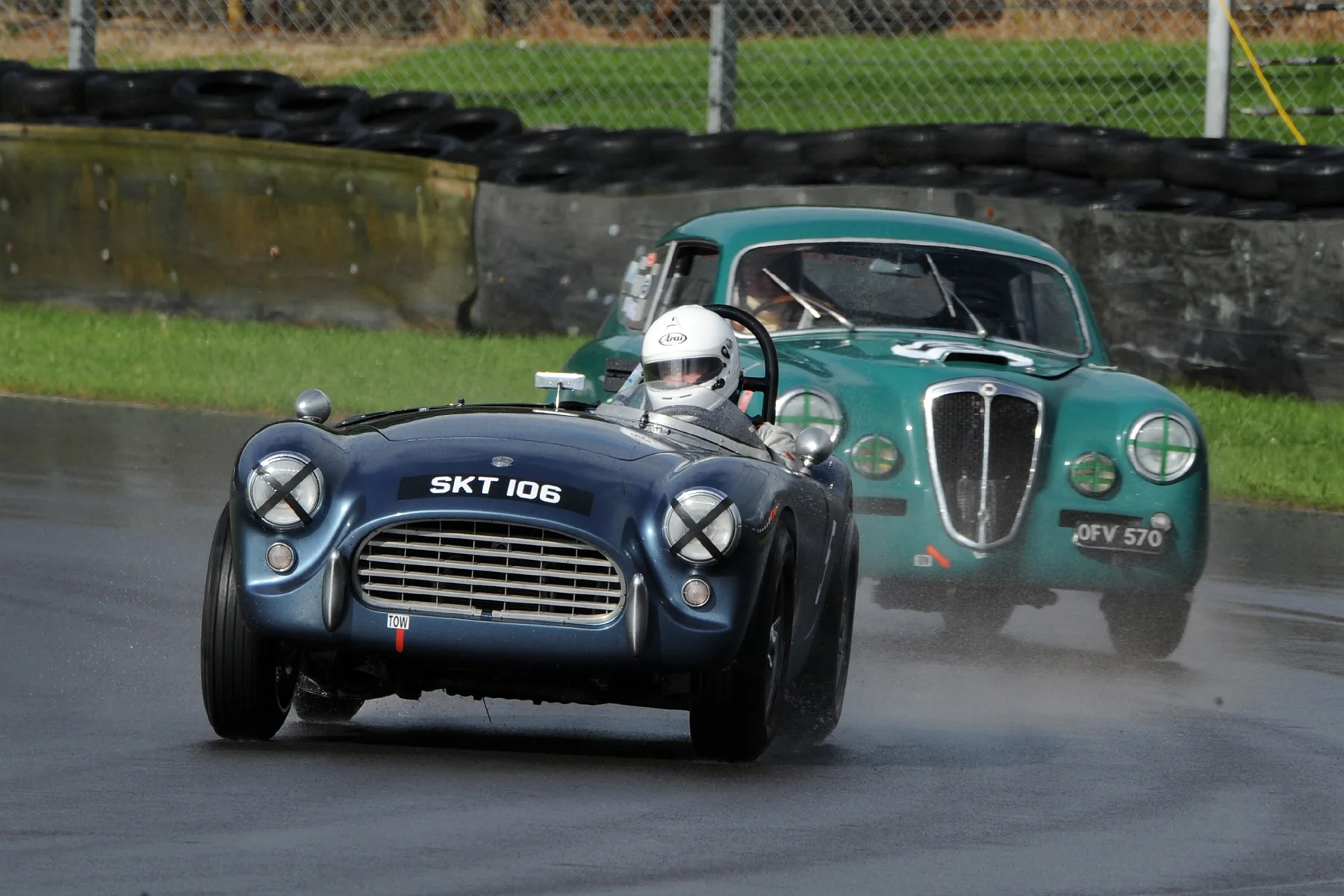 Mark Morgan in his AC Ace Bristol. Chris Gawne follows him through Quarry in his Lancia Aurelia B20GT Photo - Jeff Bloxham