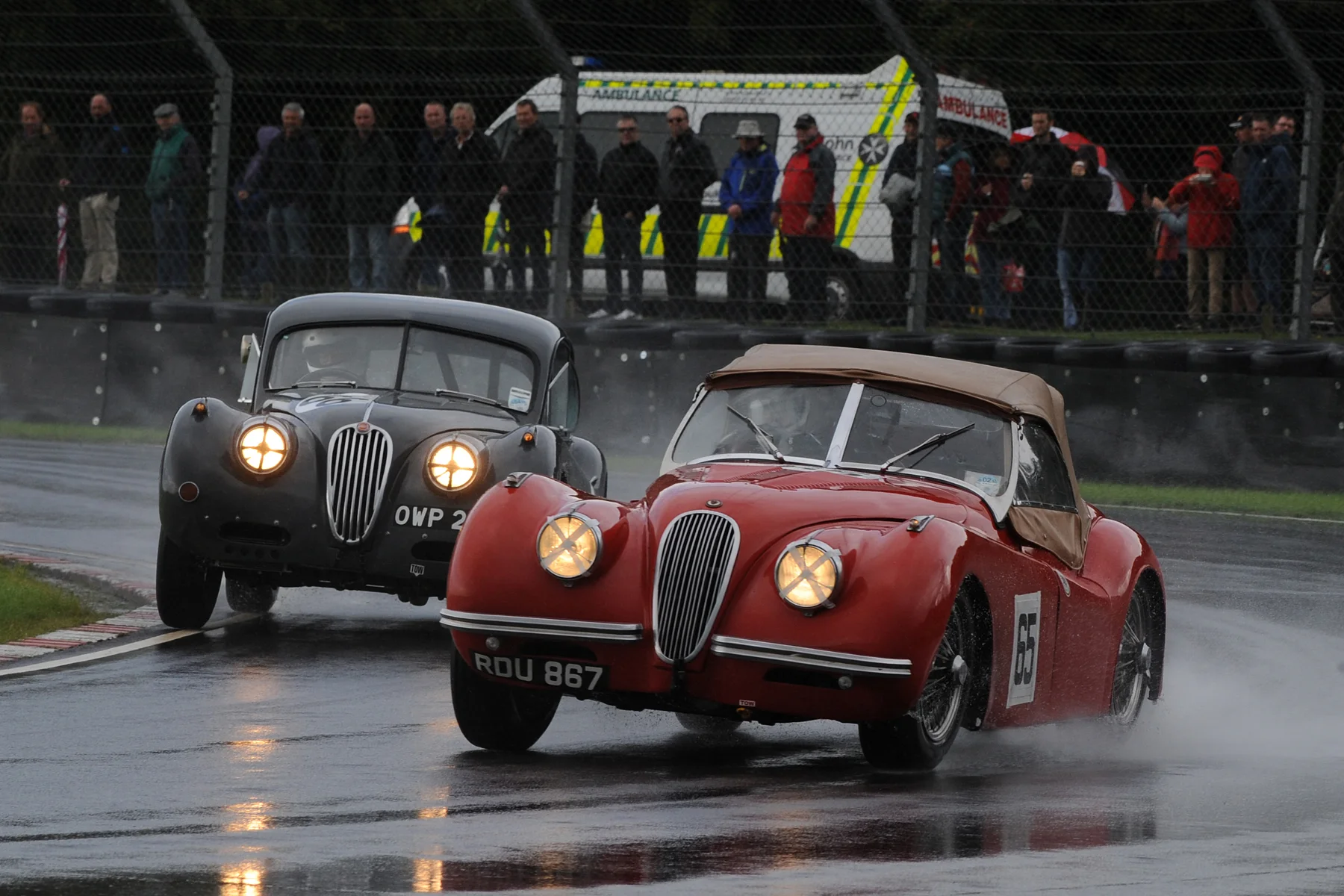 Geoff Ottley leads Kevin Zwolinski in their all XK120 early battle for 2nd place Photo - Jeff Bloxham