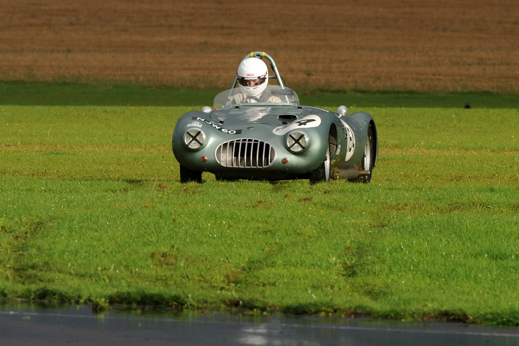 At the end of lap 2, Craig McWilliam spun the Keift Climax out of Camp, harmlessly onto the infield opposite the paddock, and was able to rejoin the race. Photo - Jeff Bloxham.