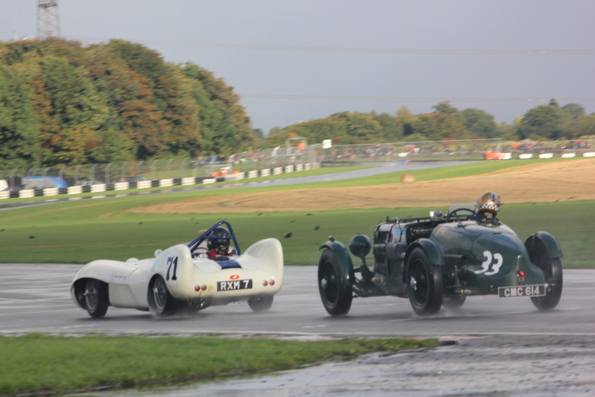 Simon Diffey catches Brian Arculus. Note that the rad cap on the Aston is at least at the same height as the top of the roll cage on Brian's Lotus. I think a driver with less experience than Brian might have been a little intimidated by the vision presented in his rear view mirror if indeed he could see anything. I think, on reflection, I'd probably make Simon my driver of the race. Photo - Pat Arculus, Tripos Media
