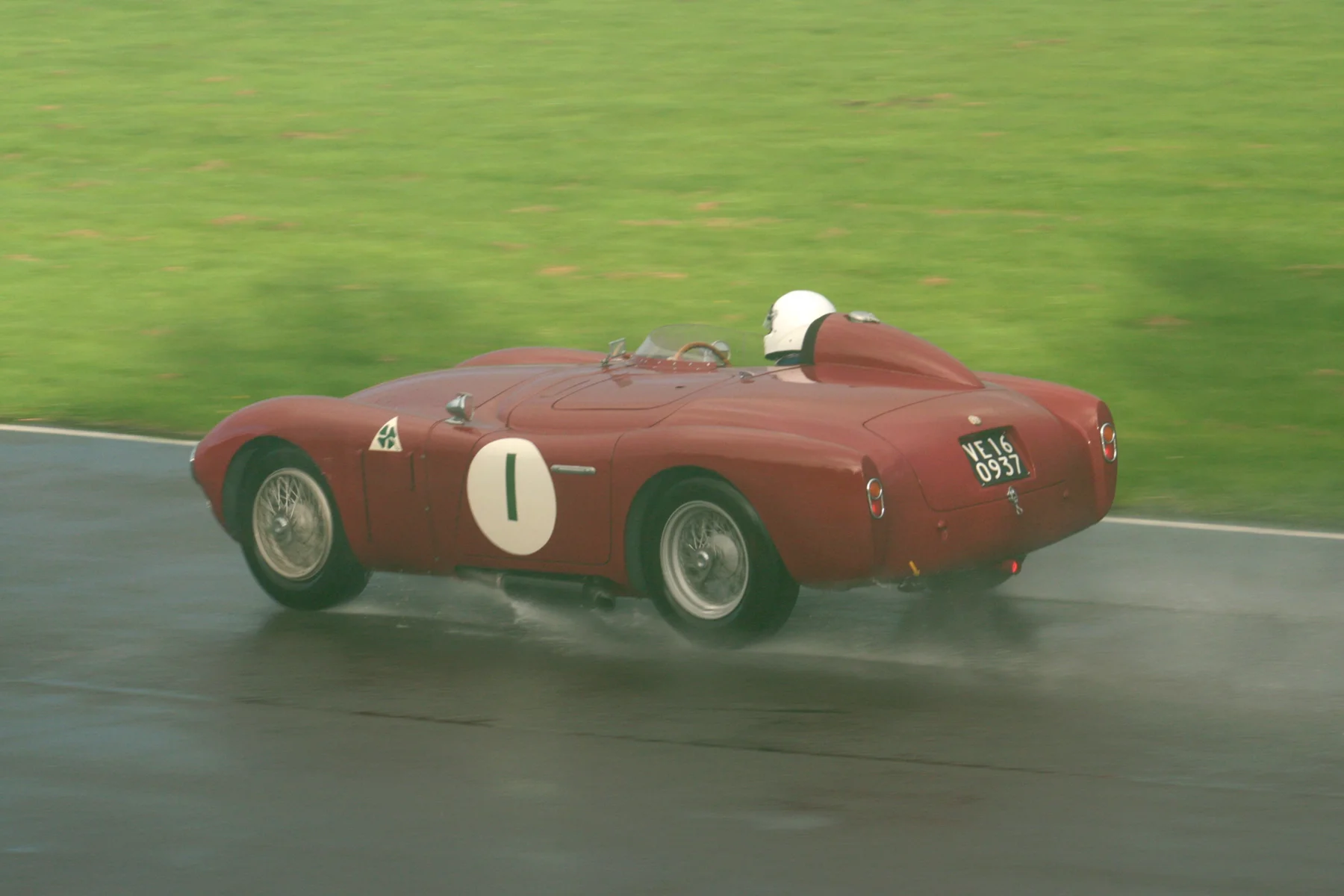 Chris Mann's Alfa Romeo Disco Volante. This most photogenic of cars is, very unusually, not well represented in my choice of photos for this race, so I have picked one of my own, somewhat 'doctored' since this was taken when my camera lens had steamed up and the car in the original photo appears in a mist. The conditions were nowhere near as bright as this appears at the time. 