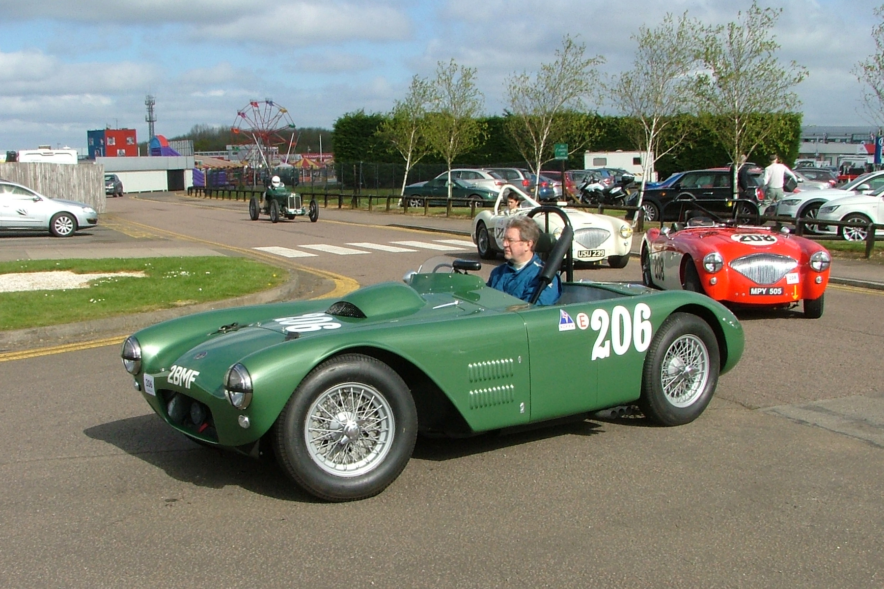 Matthew Collings quietly awaits start of qualifying practice in his HWM somehow packing a 5.4 litre V8 Cadillac engine under that bonnet making it the largest capacity car on the grid. Behind is Paul Mortimer first time out with us in his Austin Healey 100M and behind him, Richard Woolmer in Graham Robson's 100M. Photo - John Turner