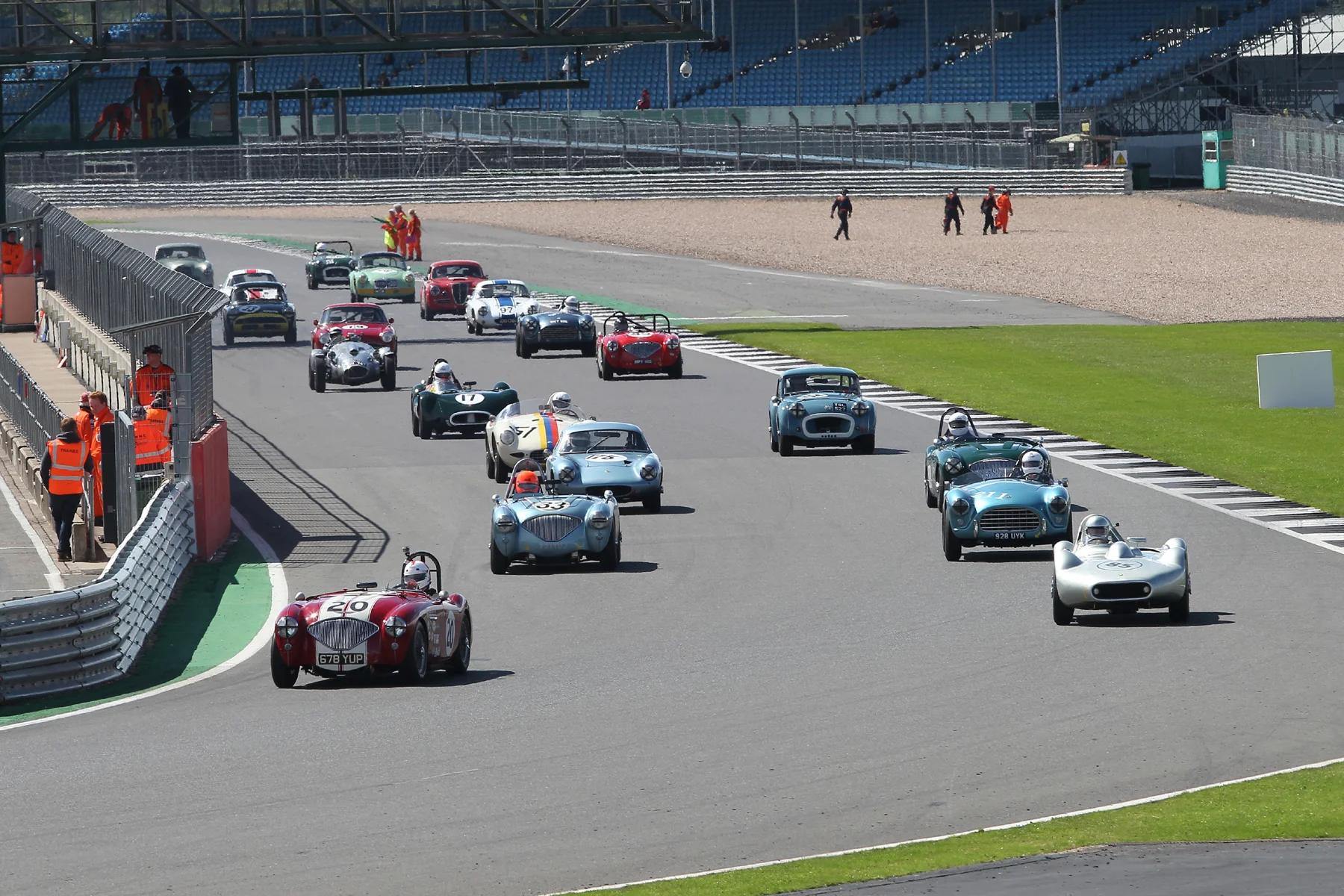 The grid rolls off on its green flag lap. The only car not in sight is Alan House's Morgan +4 tucked away to the left by the pit wall. As usual a beautiful grid of cars but we could have done with a few more. Photo - Mick Walker