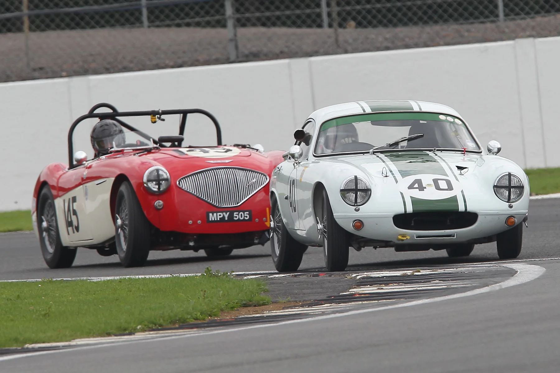 Barry Dye qualified 12th in his Lotus Elite but was unable to take the start due to clutch faiulure at the end of the practice session. Here he is followed by Paul Mortimer , also new to FISCAR with his Austin Healey 100. Photo Mick Walker