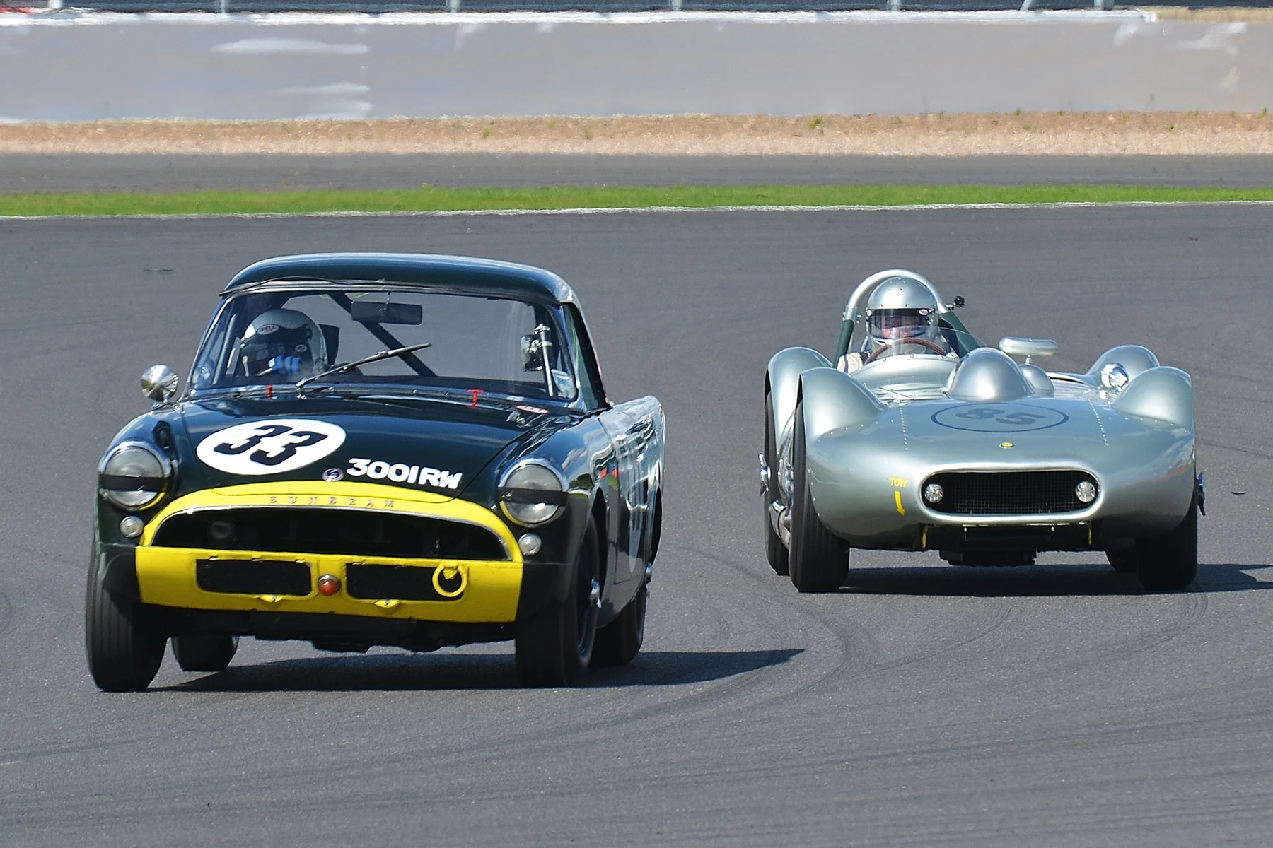 Keith Hampson's Sunbeam Alpine Le Mans about to be lapped by the leader, Stephen Bond in the Lister Bristol Photo - Peter Olley, Tripos Media