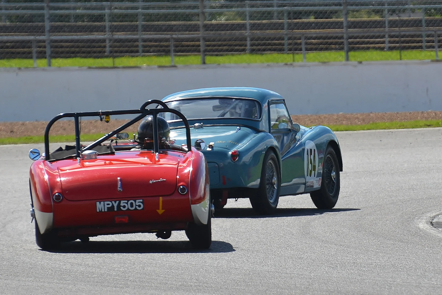 Paul Mortimer with, ultimately, a slight pace advantage hassled Paul Ziller for many laps but was unable to get by. Photo - Peter Olley, Tripos Media 