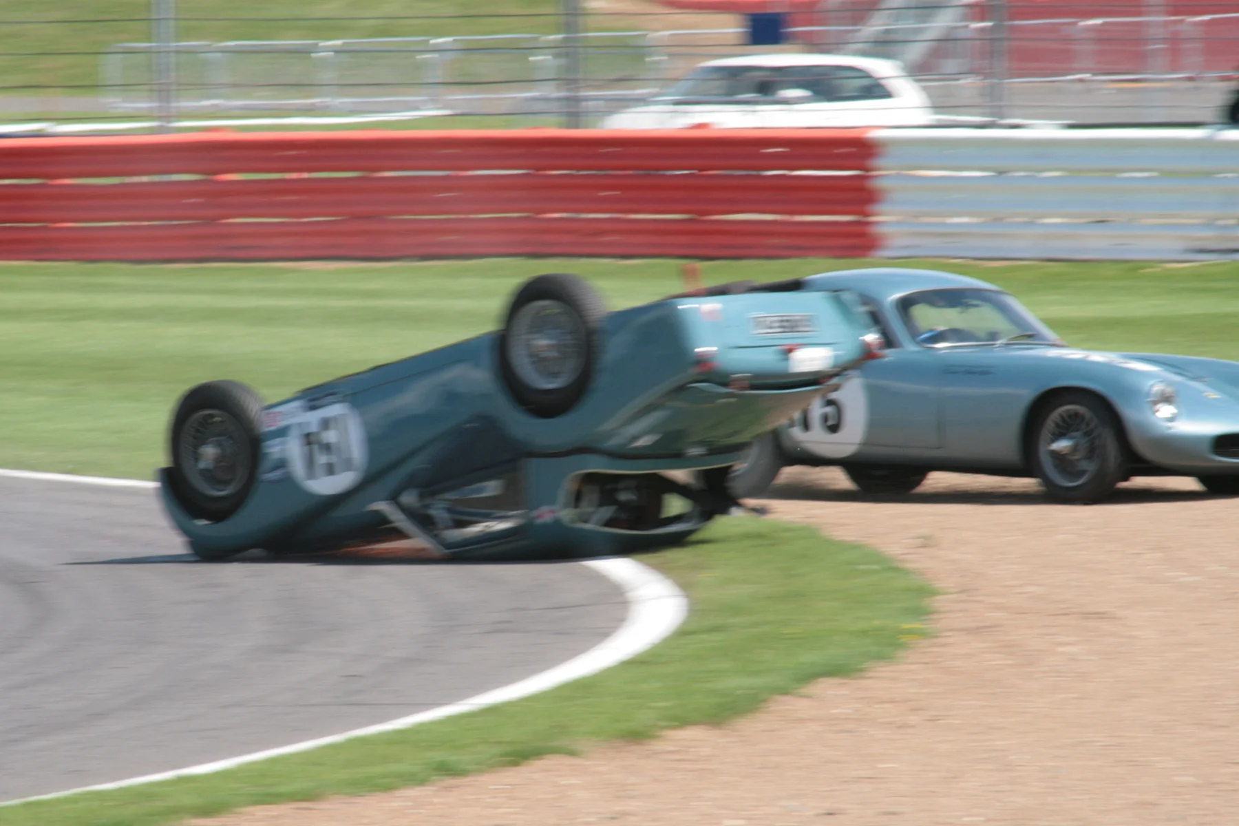 The car sliding towards the gravel trap with Robin Ellis endeavouring to keep clear Photo - John Turner