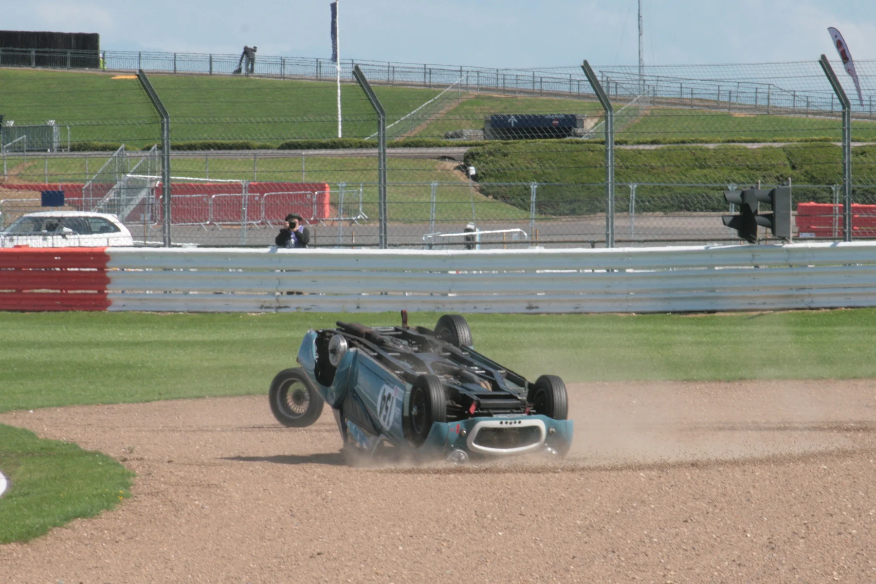 The velocity of the car as it headed into the gravel is illustrated here by the fact that the rolling wheel has only just caught up. Photo - John Turner