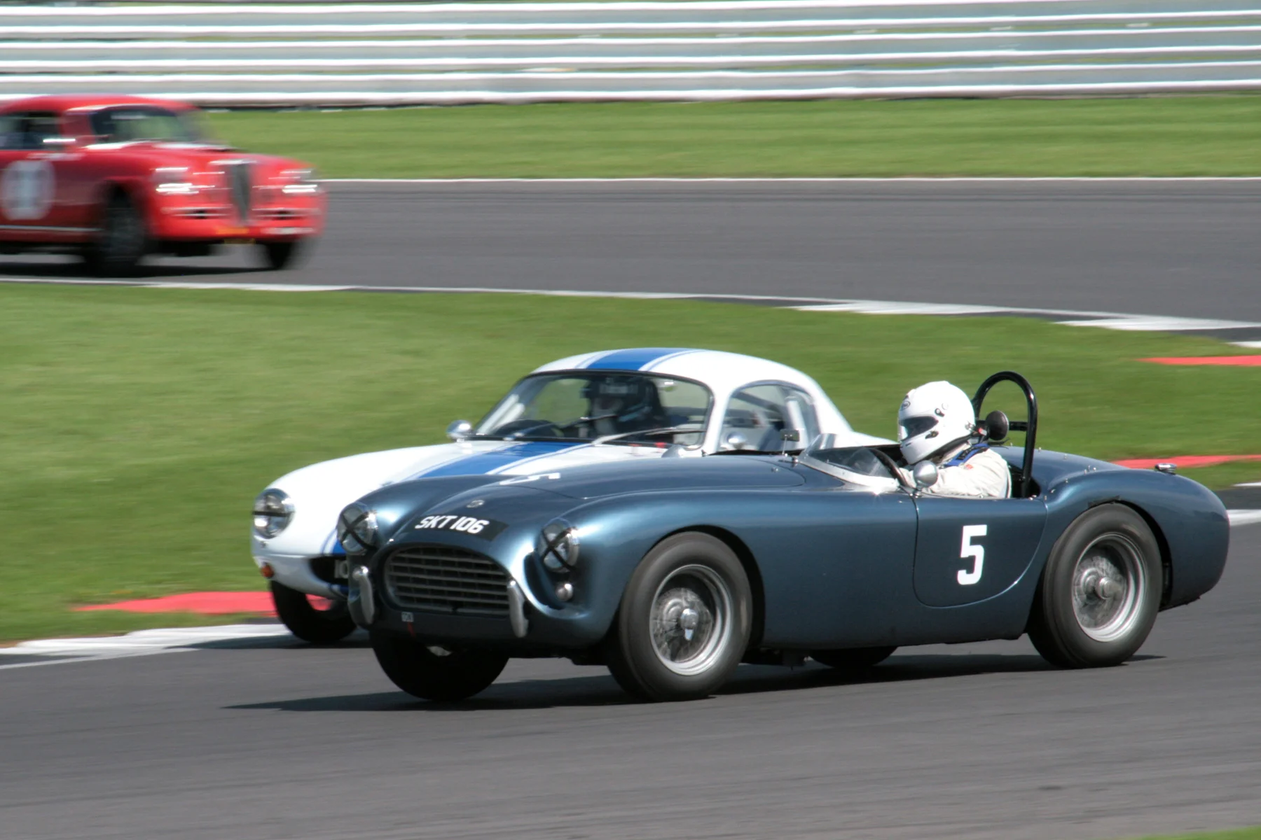 Mark Morgan had a great dice with two of the Elites before it was broken up by pit stops. Here he has his AC on the outside of Nick Atkins who is about to take his pit stop Photo - John Turner