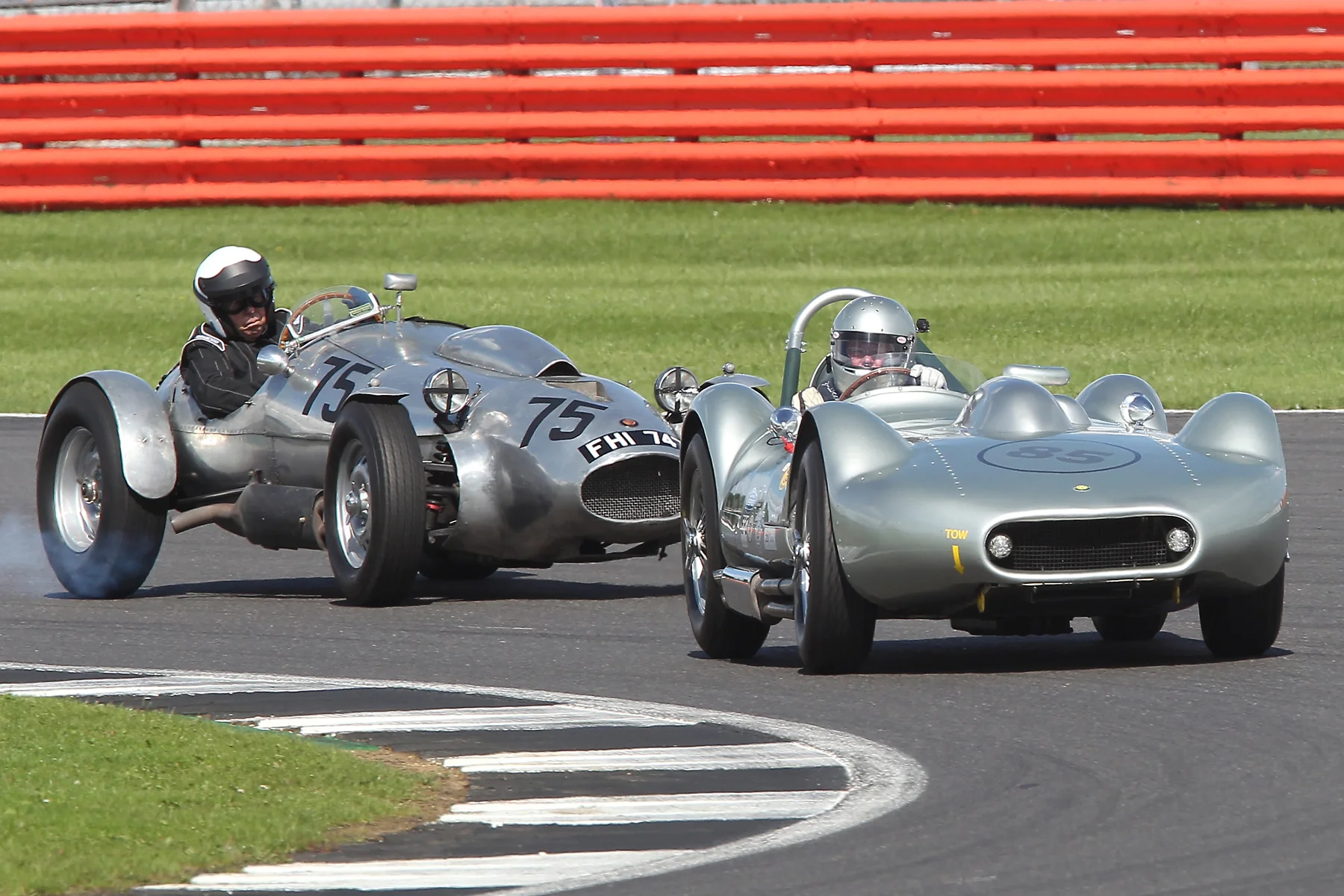 Silver Speed! Fabulous Mick Walker shot of Stephen Bond in his Lister Flatiron Bristol, and the similarly powered Wingfield Special with Peter Campbell on board. Although Stephen has just lapped Peter, the latter appears to be having a gentle lock up to ensure avoidance of the tail of the Lister. 