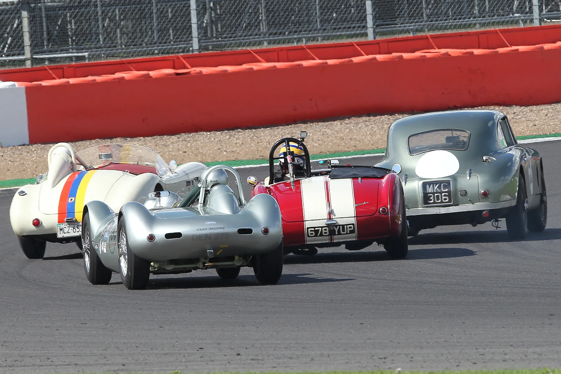 Stephen Bond presses Richard Woolmer as both try to negotiate back marker Mark Campbell in the glorious DB2 (MKC 306) and Nigel Winchester in the special bodied AC Ace (MCZ 65). Another superb photo by Mick Walker