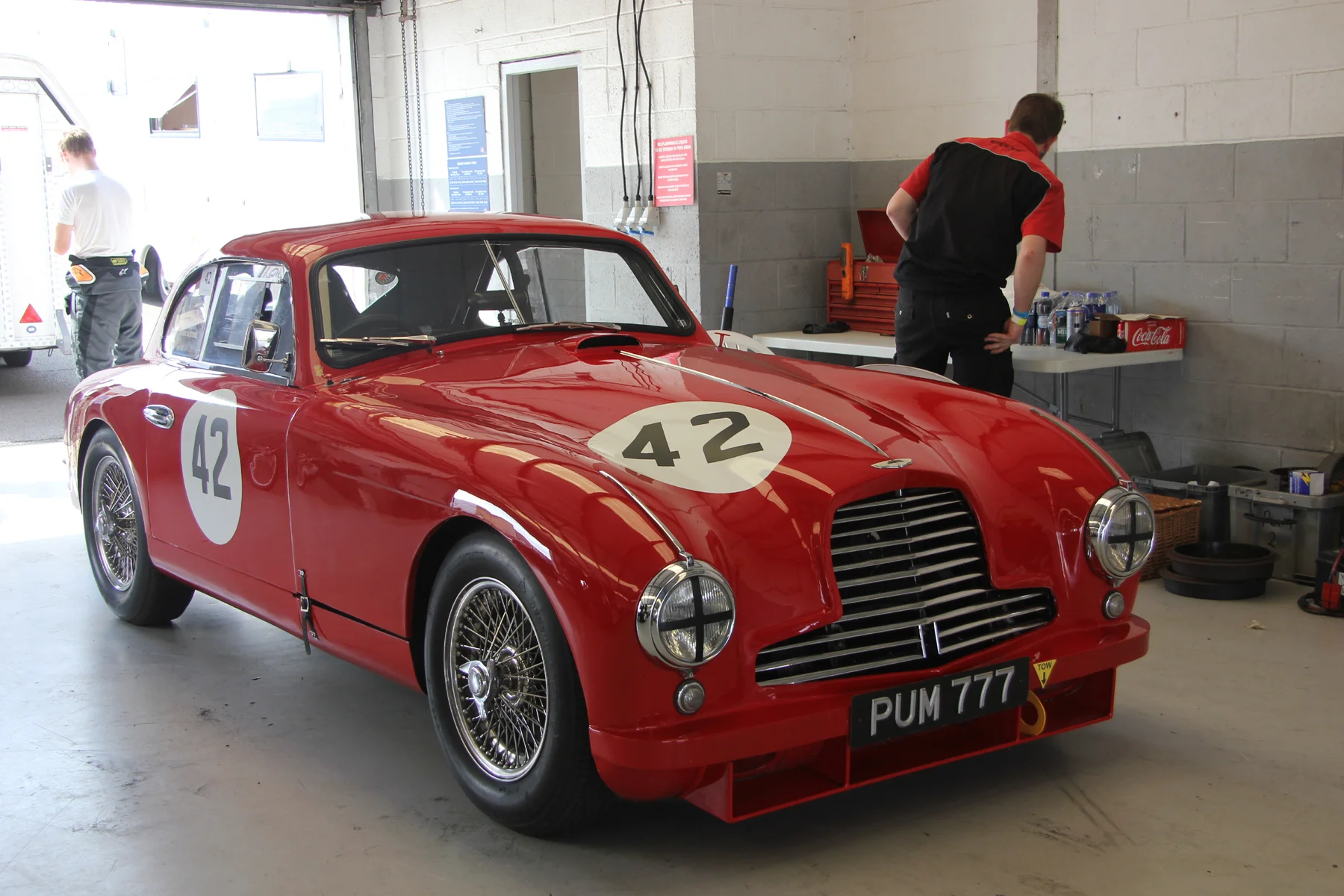 Paul Chase-Gardener's iconic Aston Martin DB2 at rest in the pitlane garage prior to the race start. Photo - Pat Arculus, Tripos Media