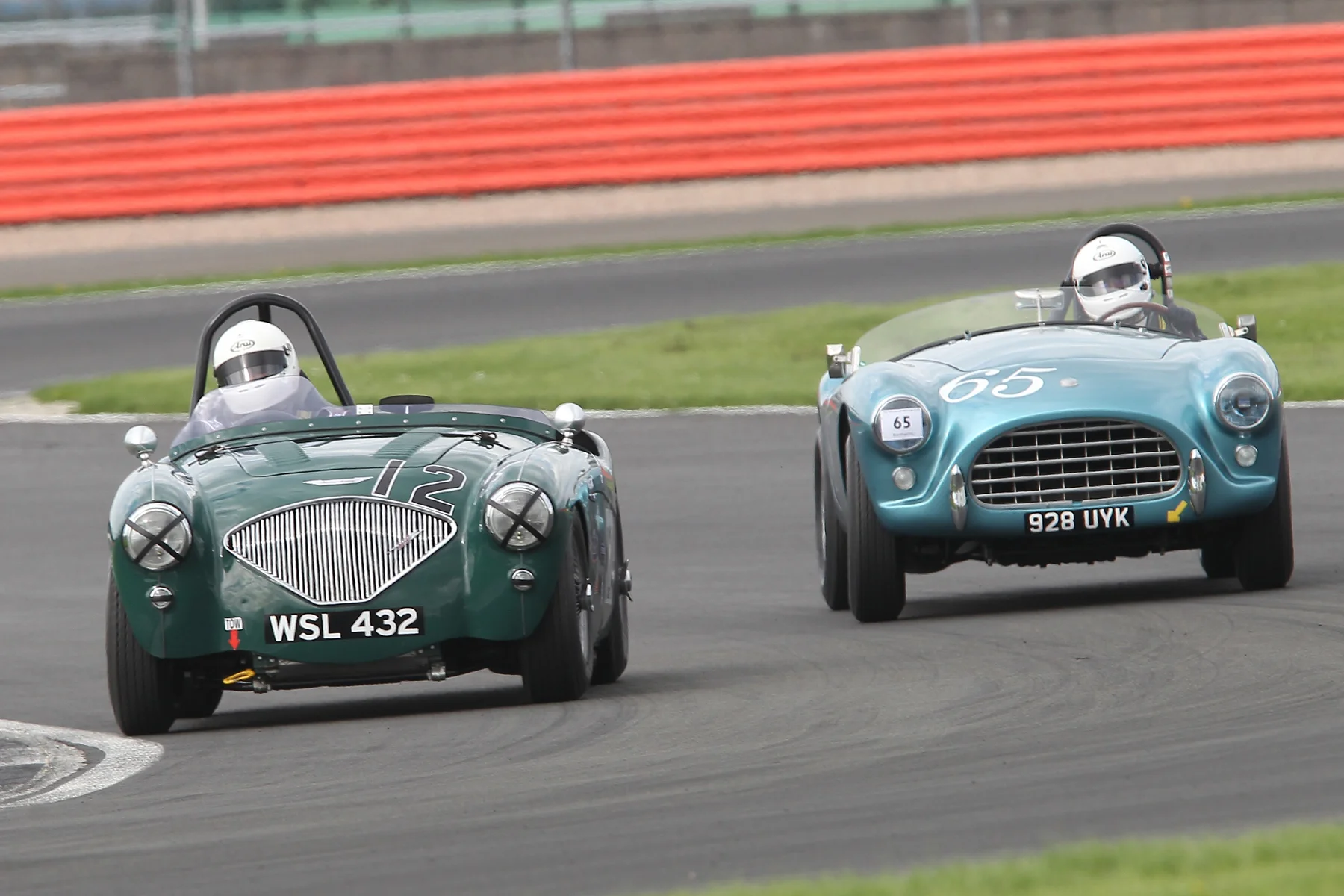 Jim Campbell (Austin Healey 100/4) and David Cottingham (AC Ace) kept company for several of the early laps. Photo - Mick Walker