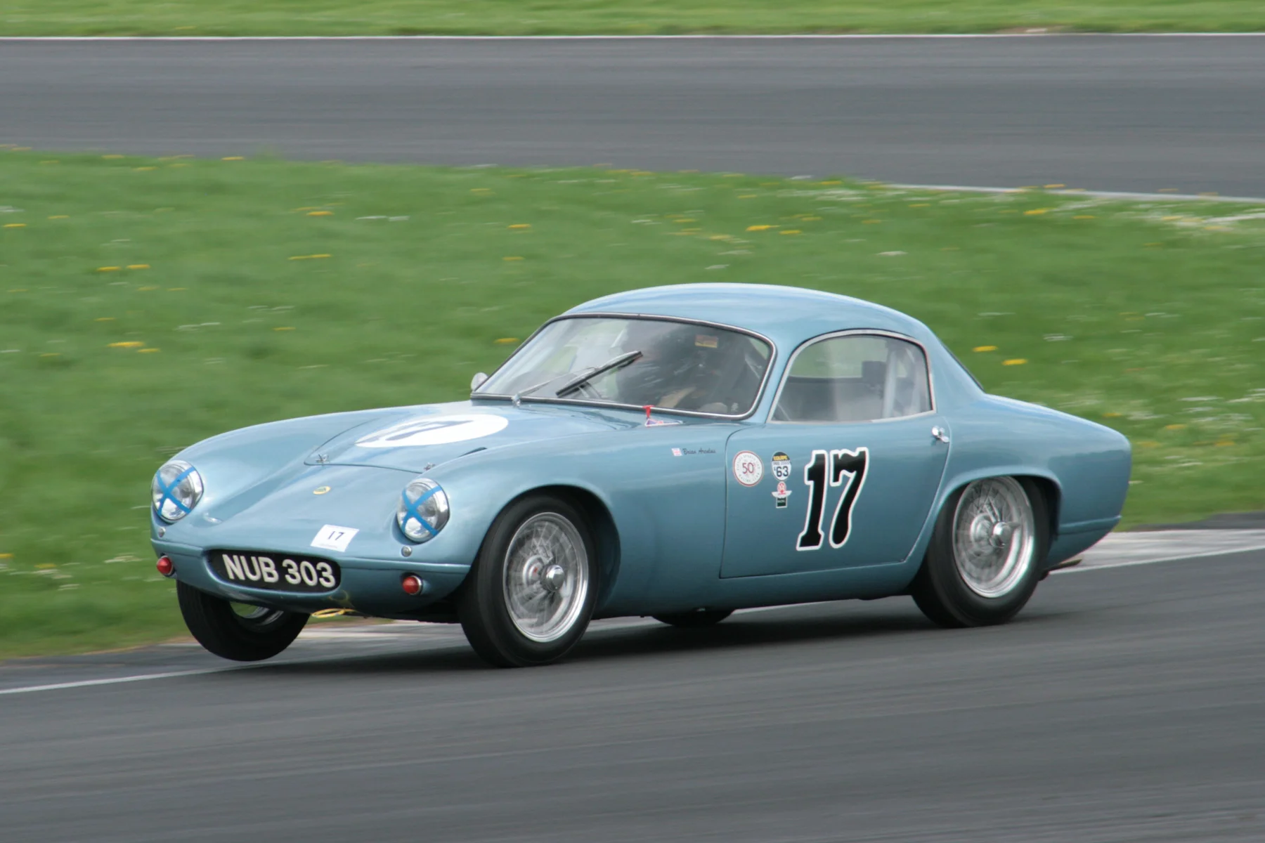 The Lotus Elite of Brian Arculus, cocks a wheel exiting Luffield into Woodcote Photo - John Turner, 