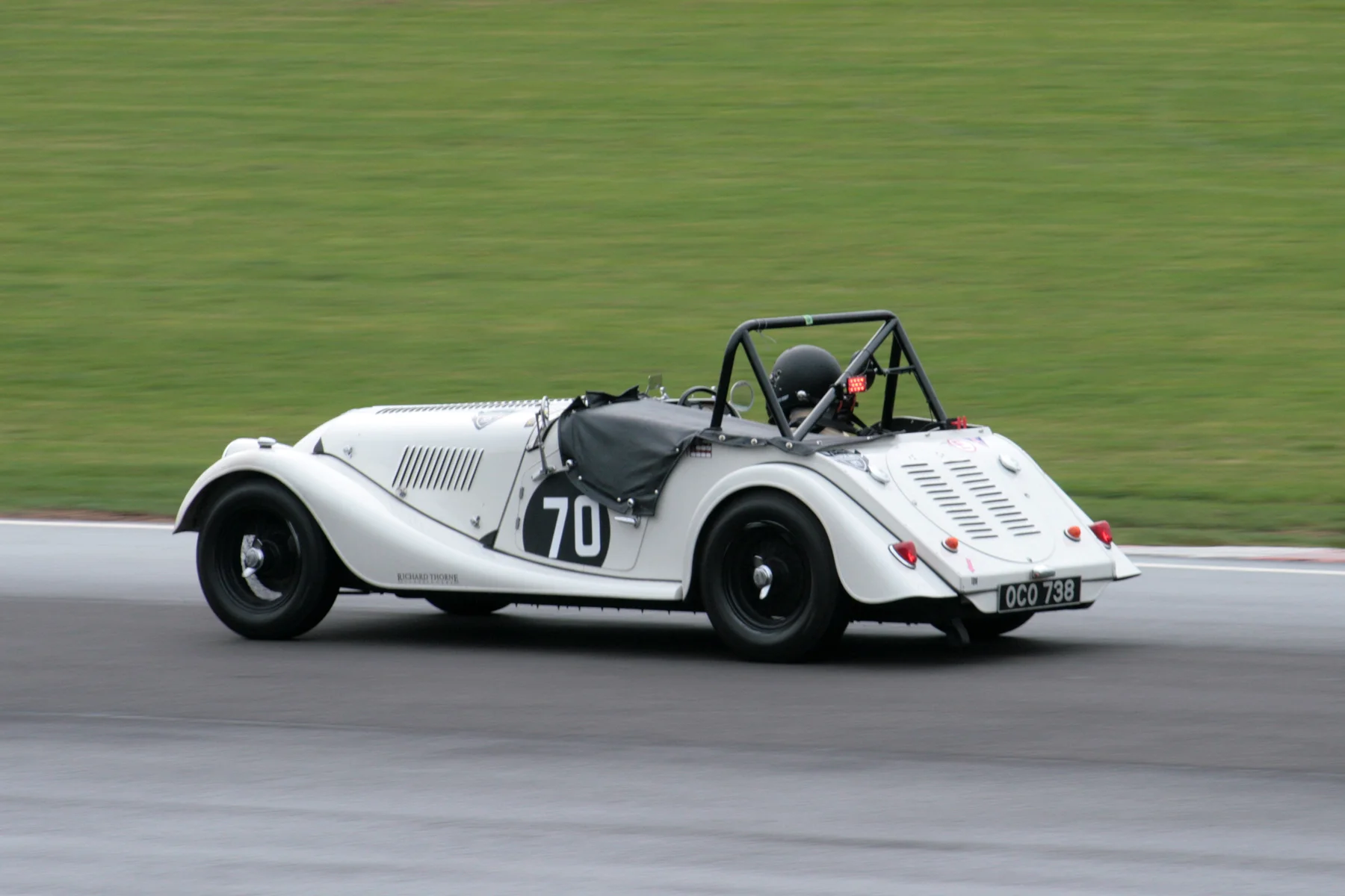 Alan House in the Morgan Plus 4. Note there is a drying line appearing on a still damp track Photo - John Turner