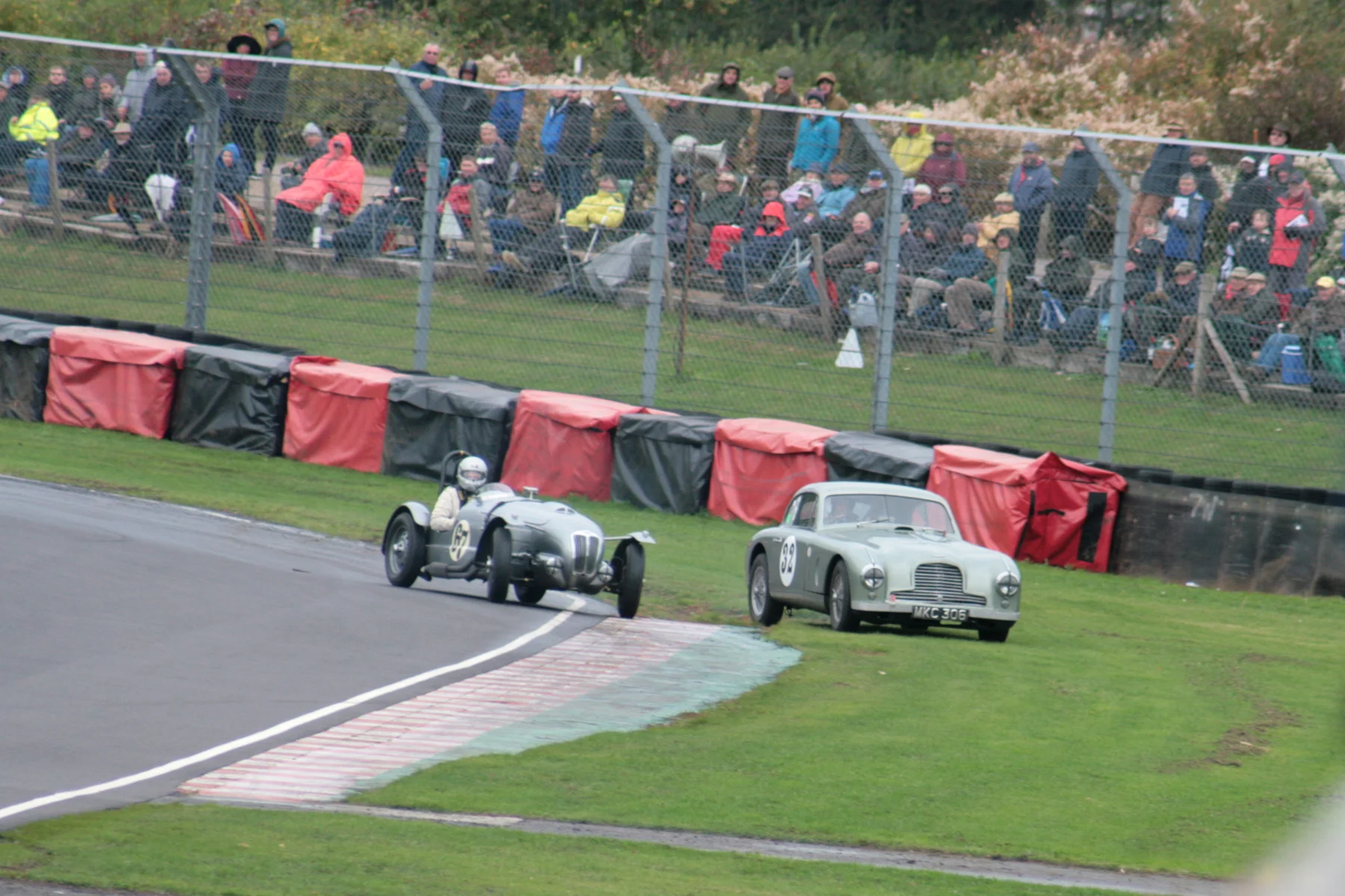 Mark Campbell takes avoiding action as he runs his Aston DB2 onto the grass whilst Ned Spieker get the Frazer Nash pointing the right way,,following a spin. Photo - John Turner