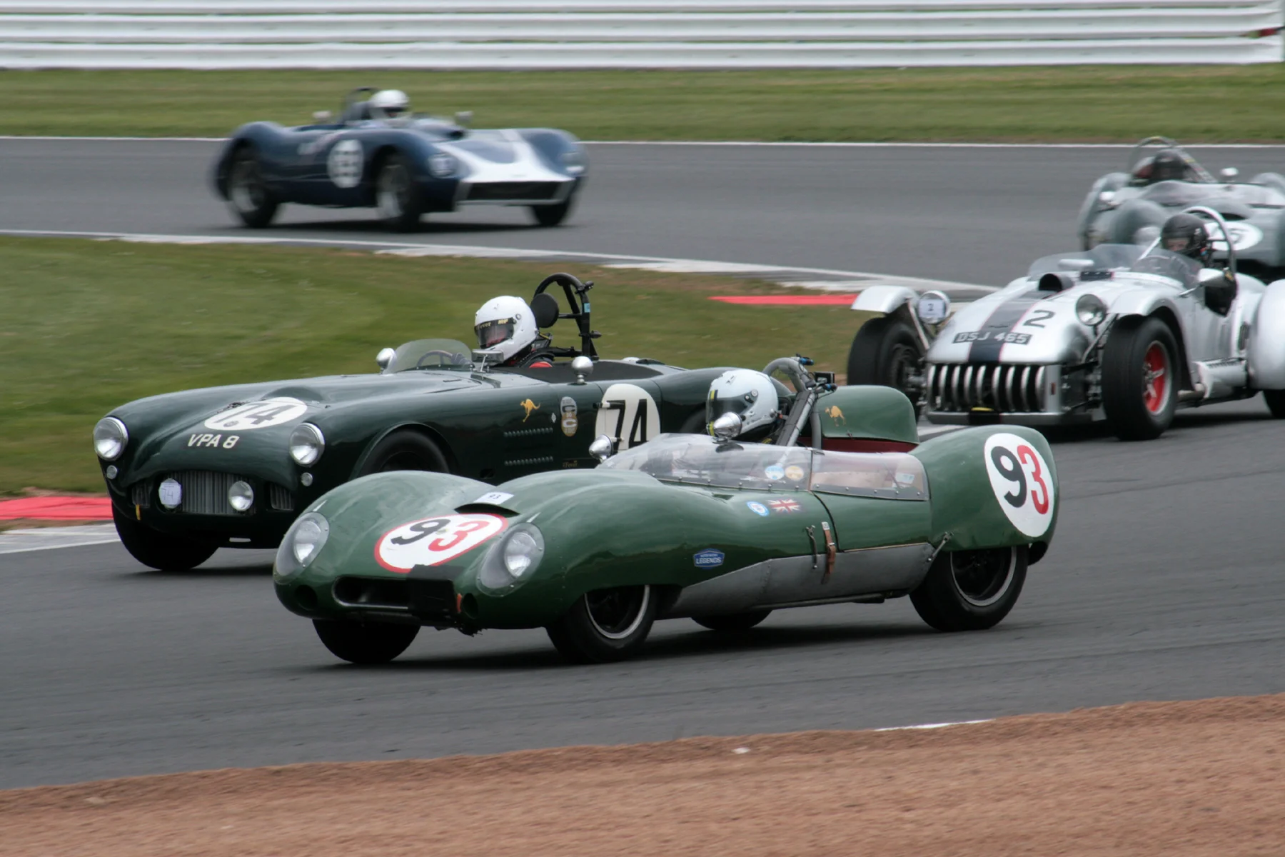 On the exit of Luffield, Martin Hunt is about to take 3rd overall in the HWM (74) as the Lotus 15 of Bernardo Hartogs runs wide. Chris Keen follows Martin through to take 4th in the Kurtis (2). The pace of these two contenders for the Tom Cole Trophy was such that they were well up among the potentially quicker Hawthorn International Trophy Cars. Photo - John Turner