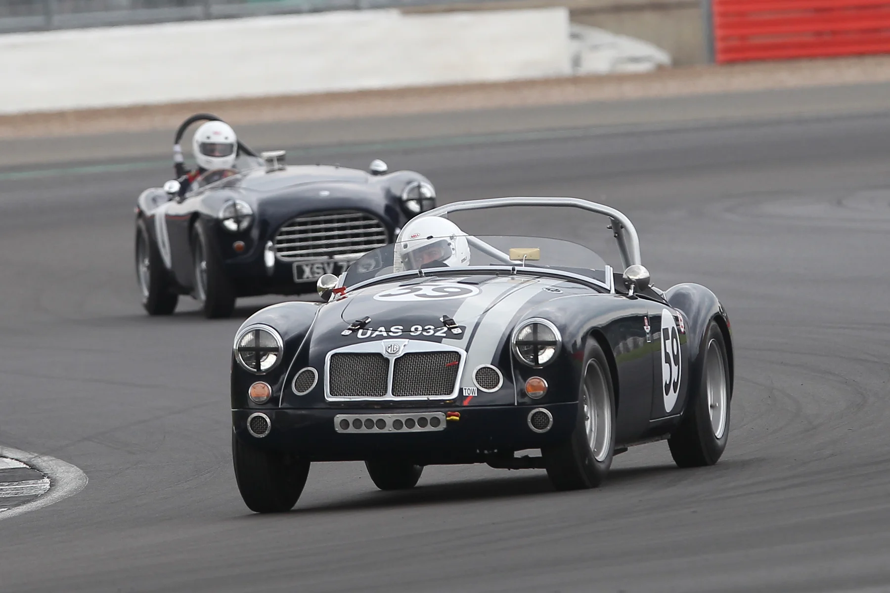 Neil Burnside has his MGA ahead of Justin Becket’s AC Ace before the latter retired with a broken driveshaft Photo - Mick Walker