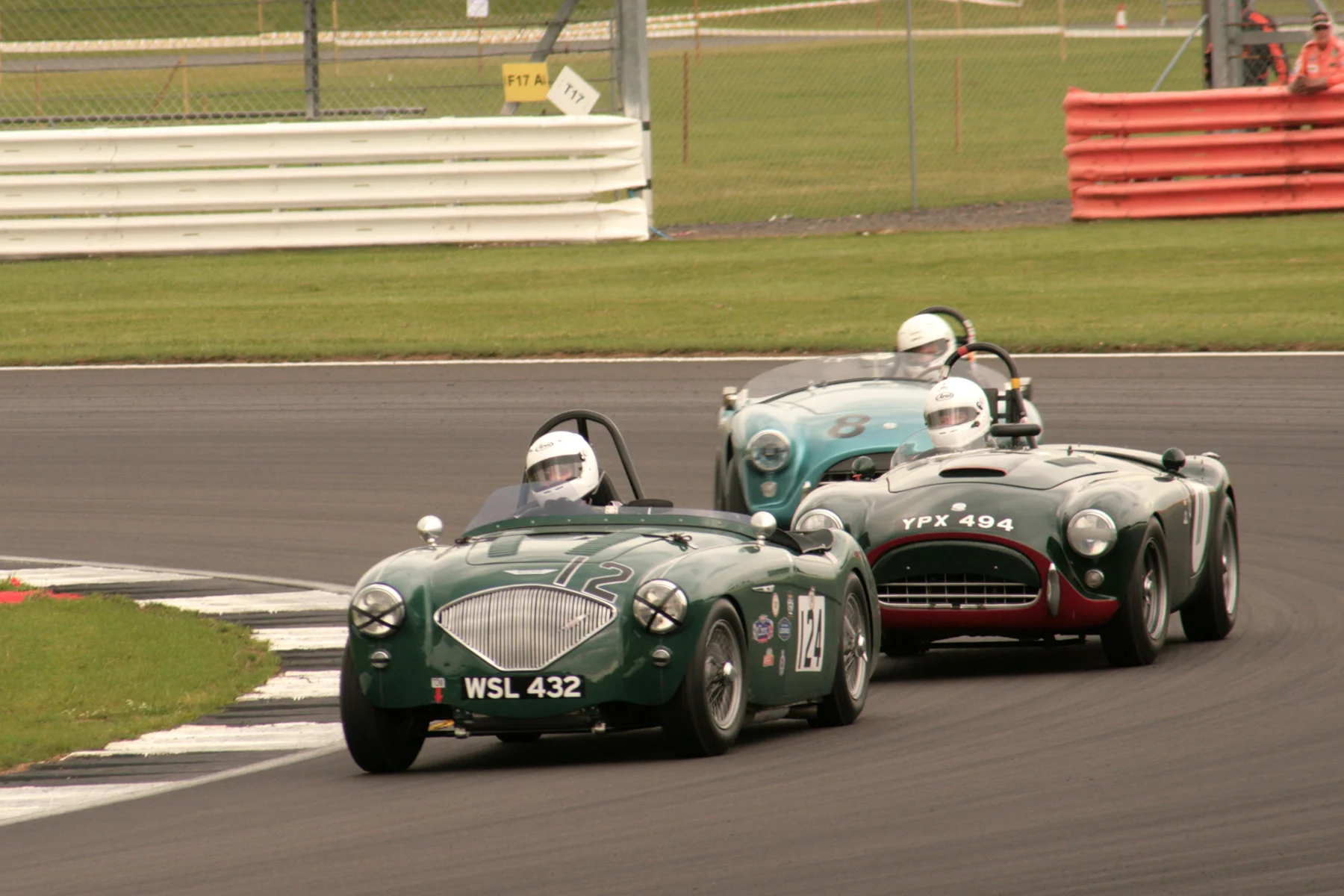 Jim Campbell’s resolute defence in the Austin Healey became undone only on the last lap when the AC Aces of Tim Pearce & Adrian King got by. Photo - JT