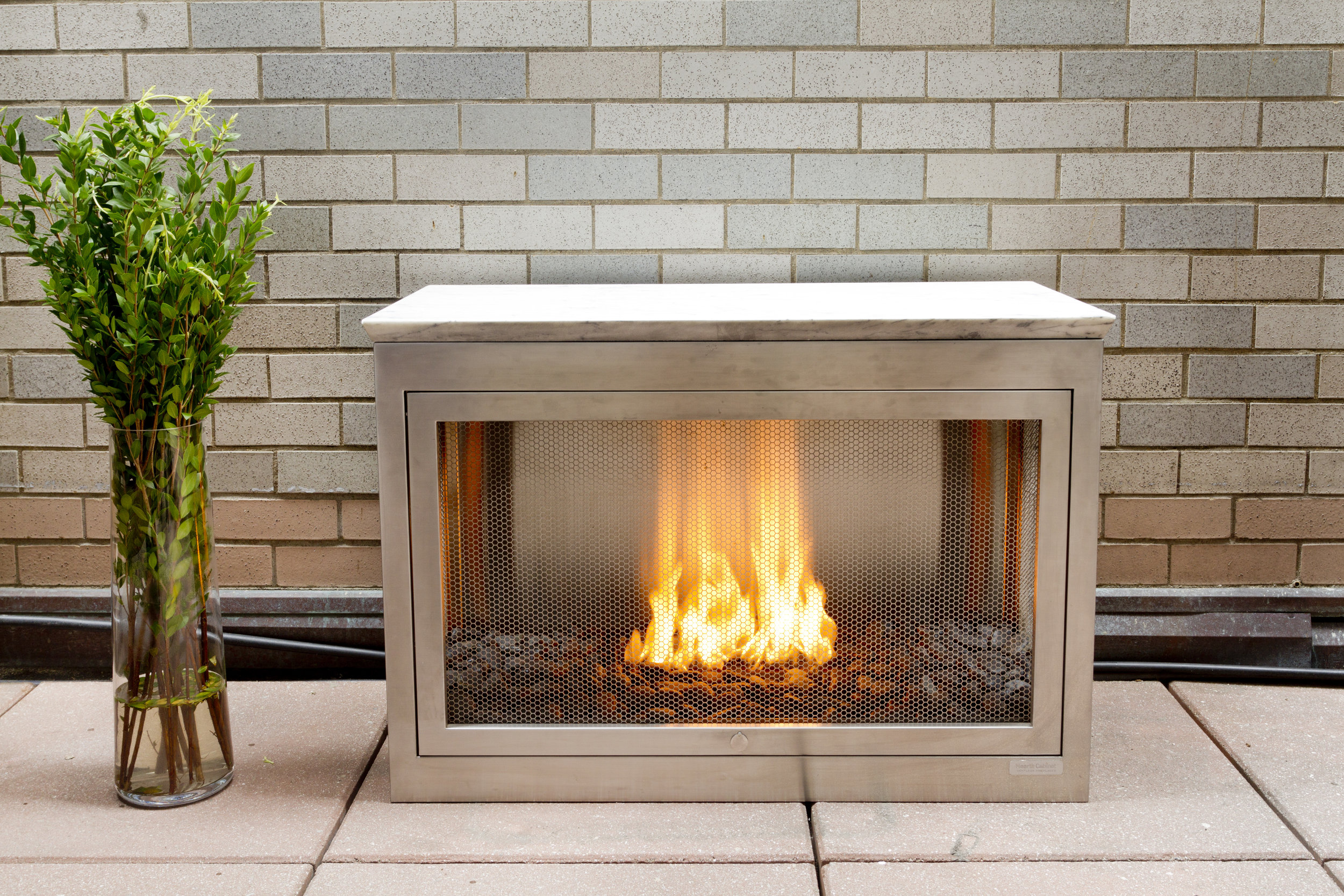  3-sided Landscape HearthCabinet Ventless Fireplace, finished in stainless steel 