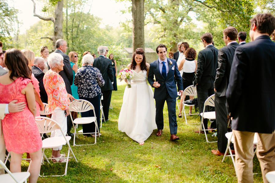 Bride and Groom walking down Aisle
