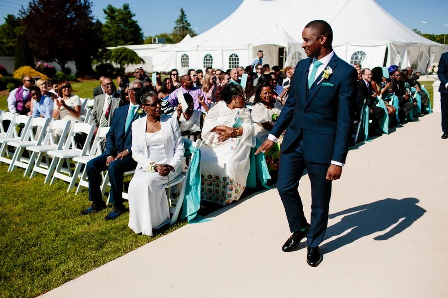 groom walking down aisle