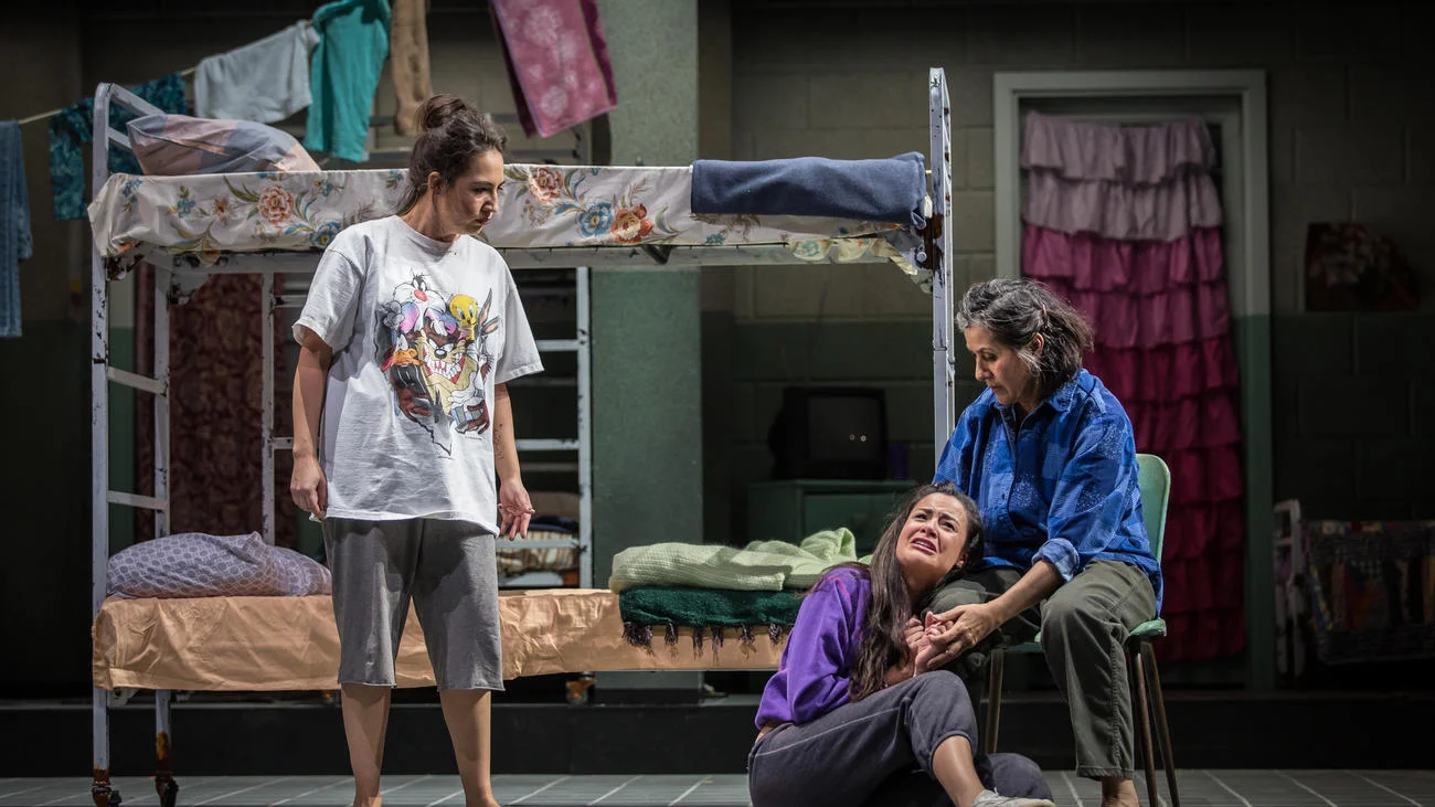 Heather Velazquez as Maikelyn/Eva/Paramilitary, Stephanie Andrea Barron as Yolanda and Socorro Santiago as Ciliana in "Another Word for Beauty" by Jose Rivera, directed by Steve Cosson at Goodman Theatre (January 16 – February 21, 2016).