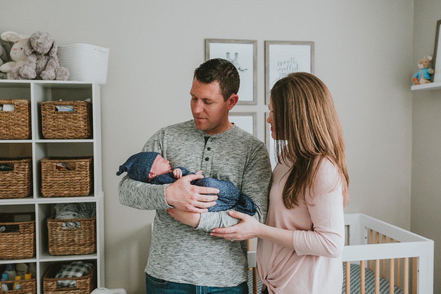 Parents-And-Newborn-In-Nursery