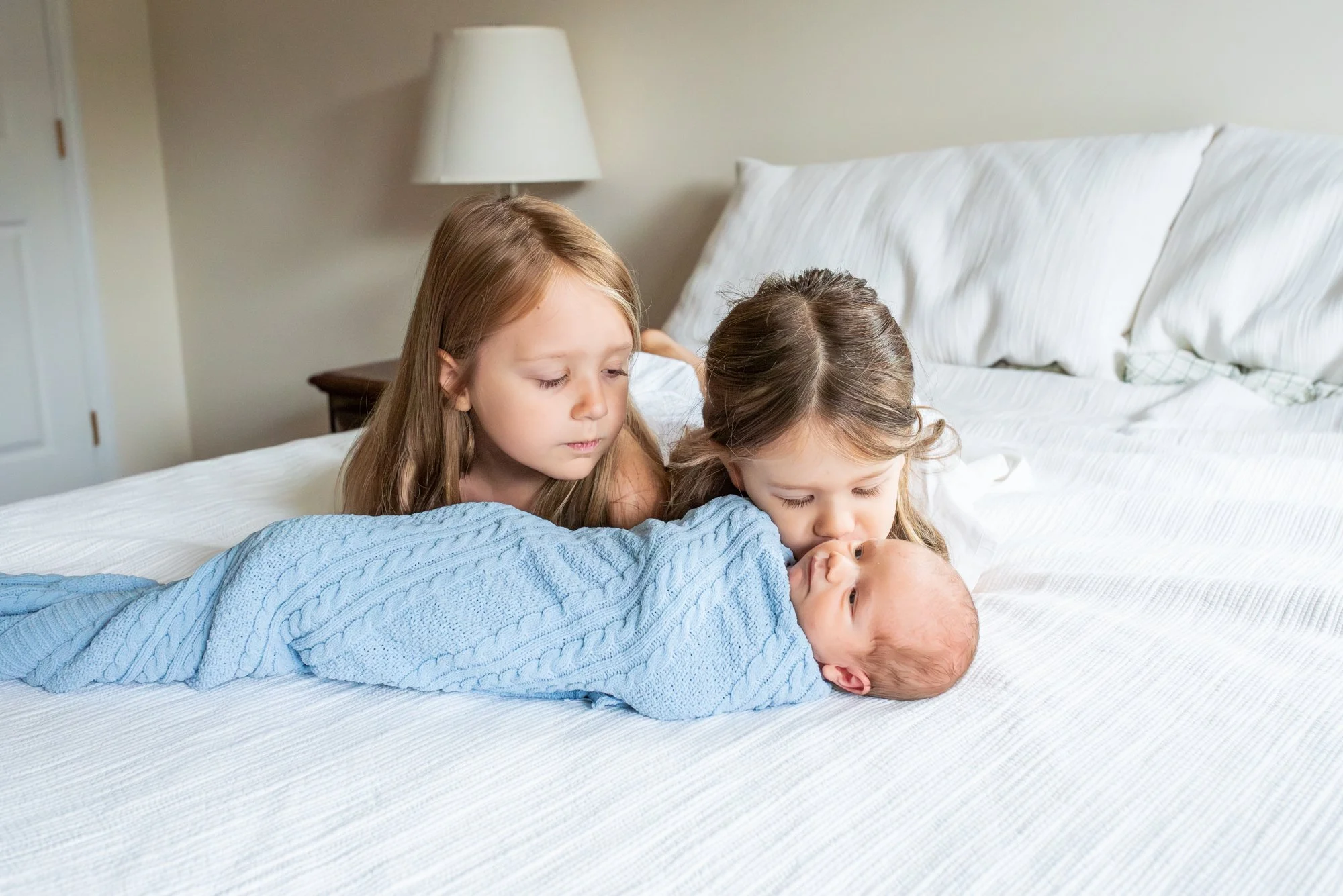 Big-Sister-Kissing-Baby-Brother-In-Home-Newborn-Session-NJ