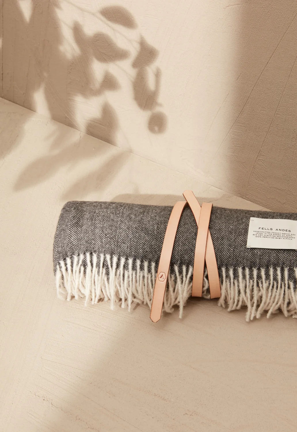 FELLS-ANDES-SILL-THROW-BLANKET-CHARCOAL-BABY-ALPACA-LEATHER-STRAPP-MID-RES.jpg