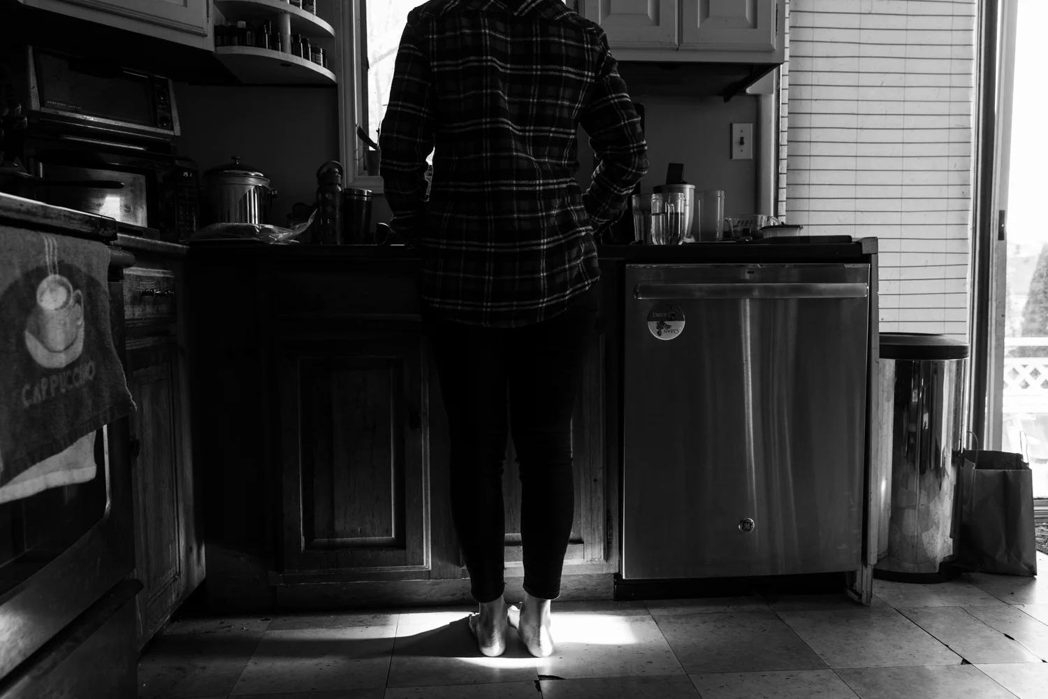 Woman standing in kitchen in Wakefield, RI