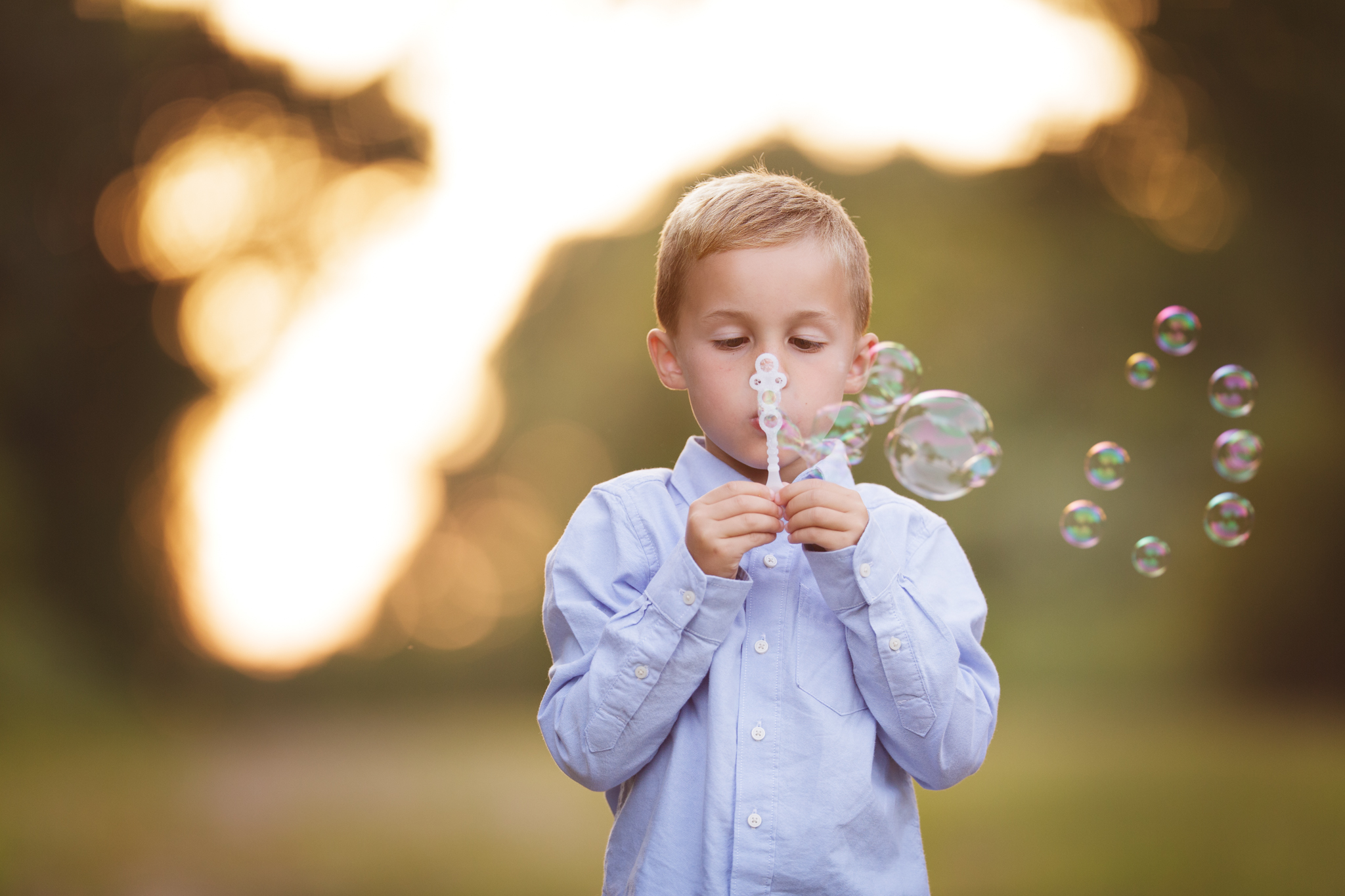 child blowing bubbles in Narragansett, RI