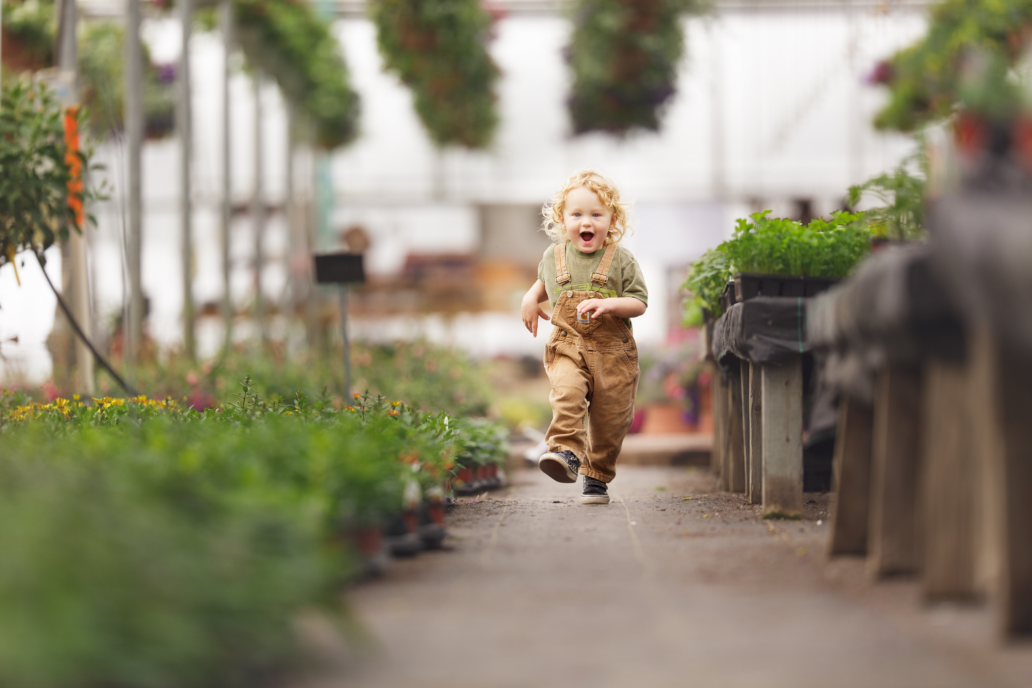 Child at Clark Farms greenhouse in Matunuck, RI