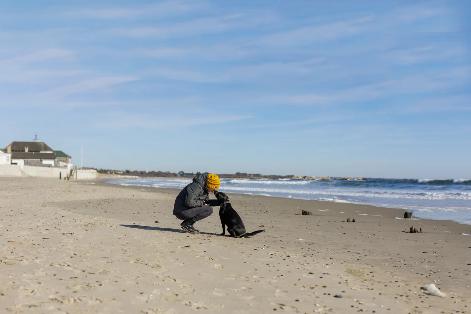woman and dog on Narragansett Town Beach