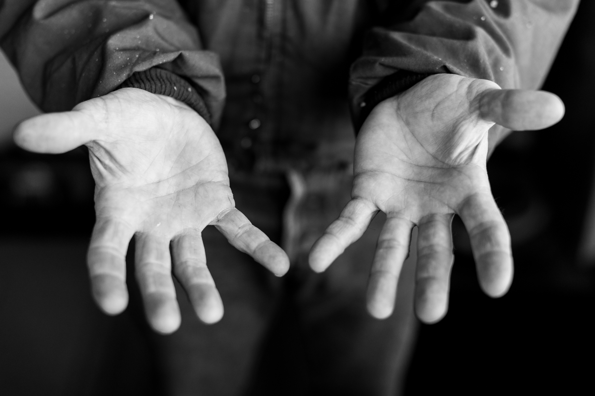 man holding out his hands