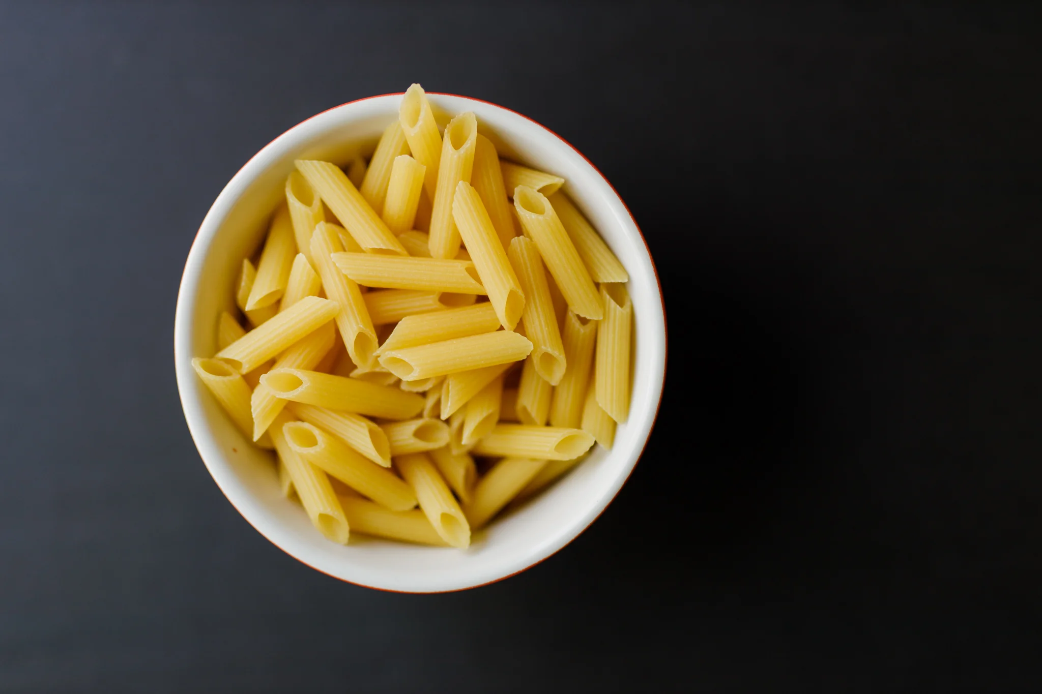 uncooked gluten free pasta in a bowl