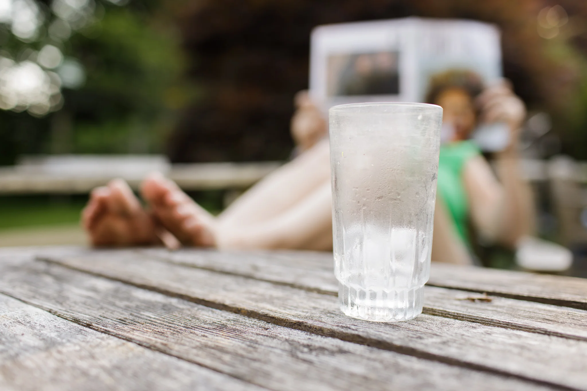 empty water glass on patio table