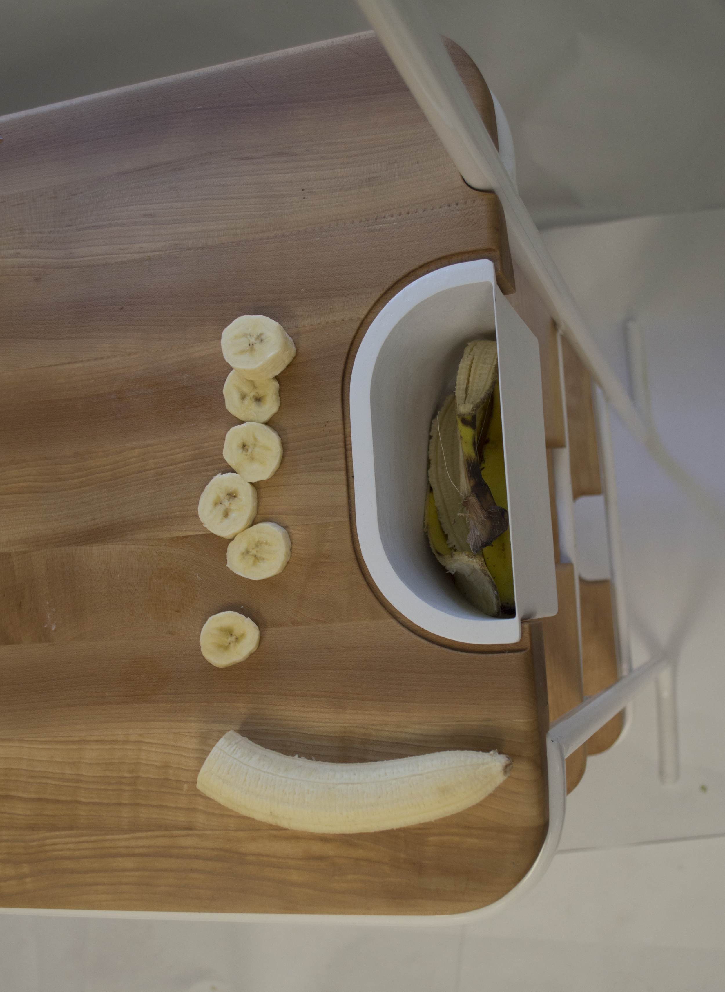 Integrated waste container. All the discarded food scraps from chopping can be put into the waste bin and added to compost container.