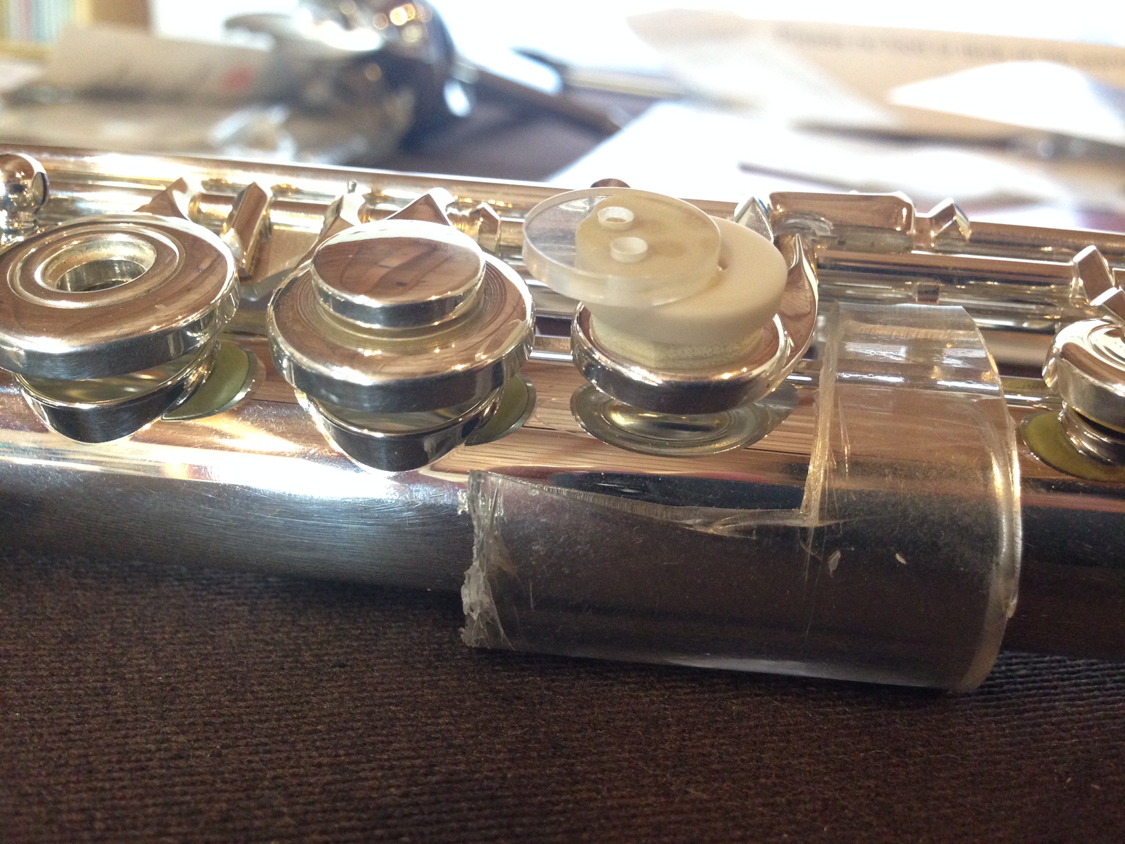 I glued two buttons to each other with glue. The bottom button is taped to the key with double-sided foam tape. This is what I would suggest as a DIY C# key modification.