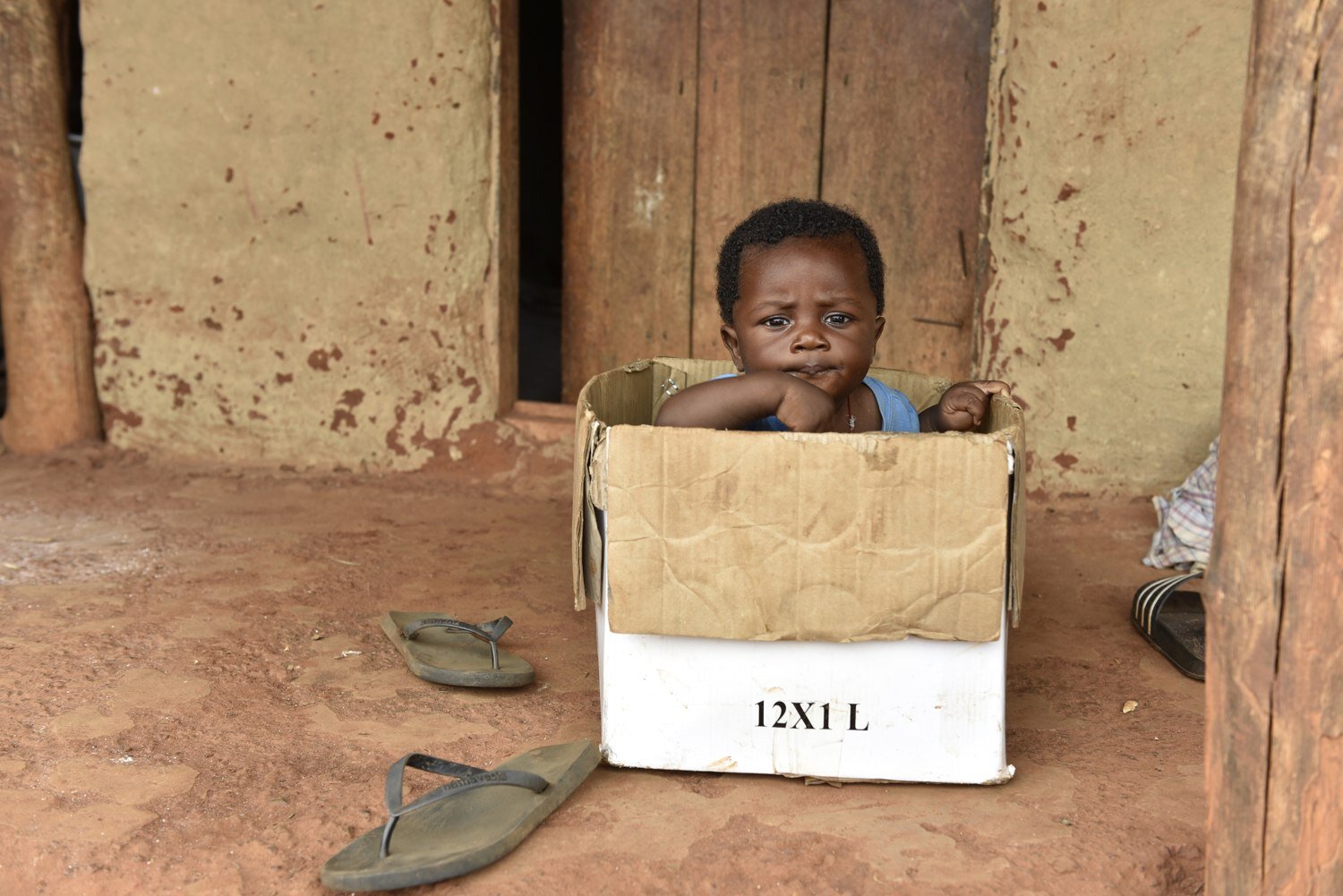Kid in a box. Ghana.