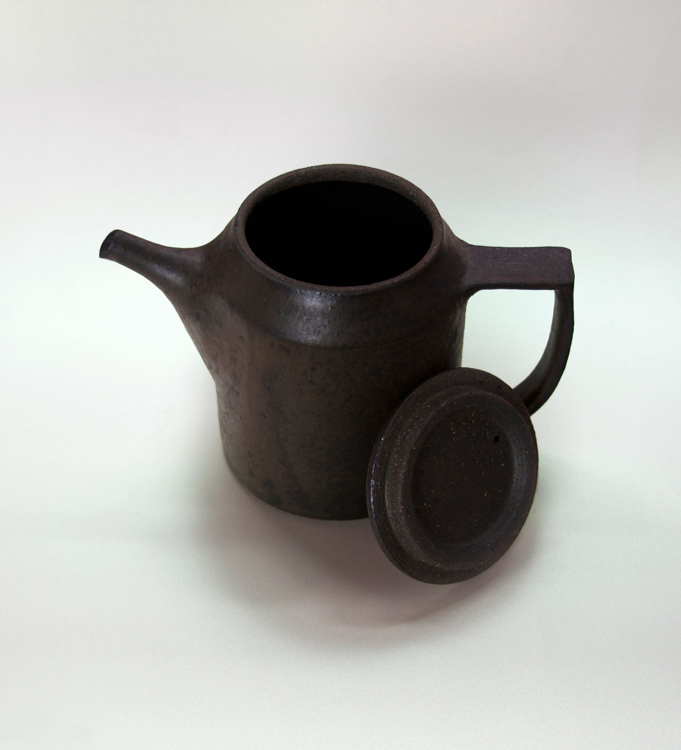 The frosting on this handcrafted coffee pot makes camp gets an iron like feel. See it on japan-suite .