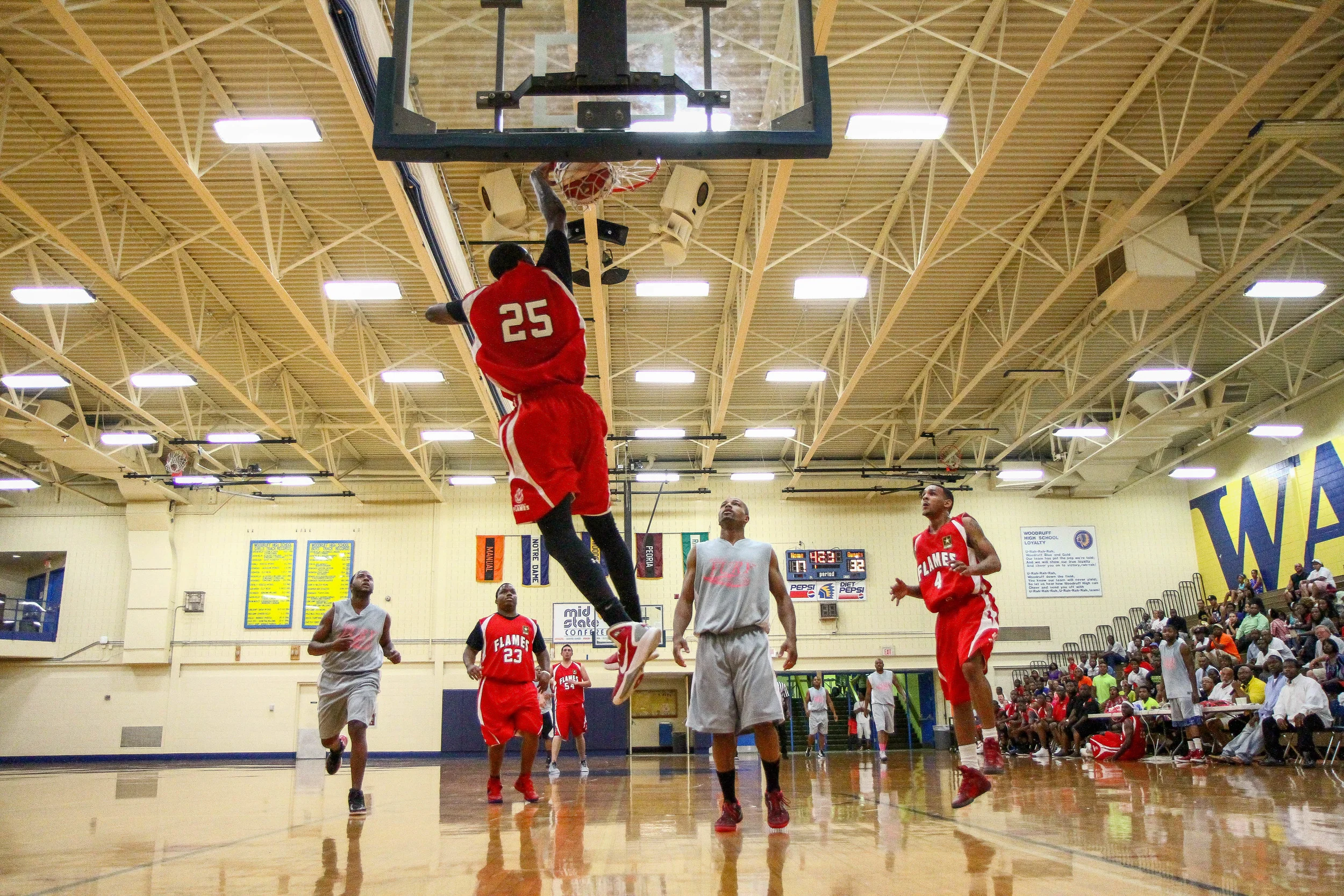 Midwest Flames player number 25 dunks during an exhibition game between the Midwest Flames vs Chicago Fury