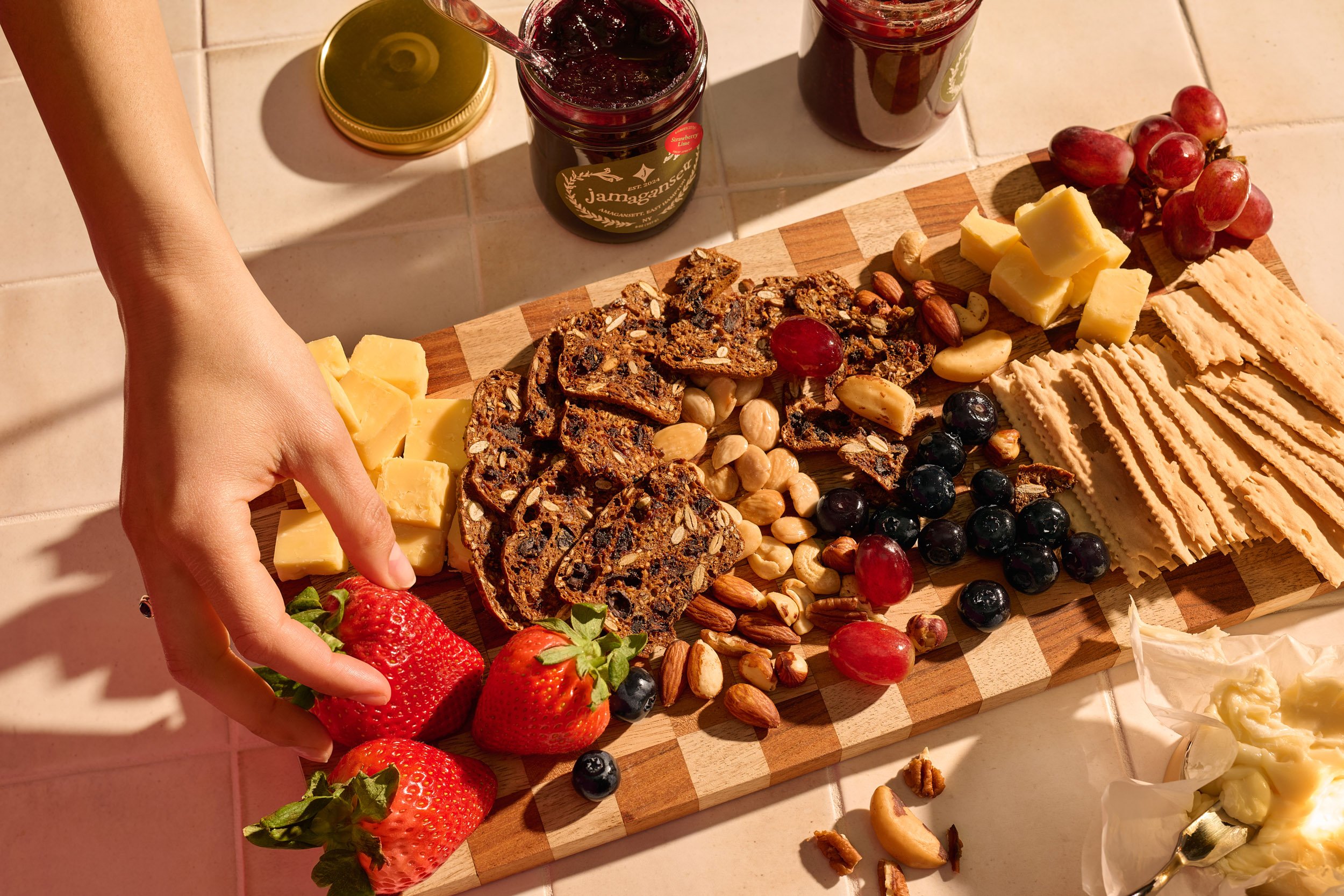 021925_Jamagansett_Tribeca_Cheeseboard_Hand.jpg