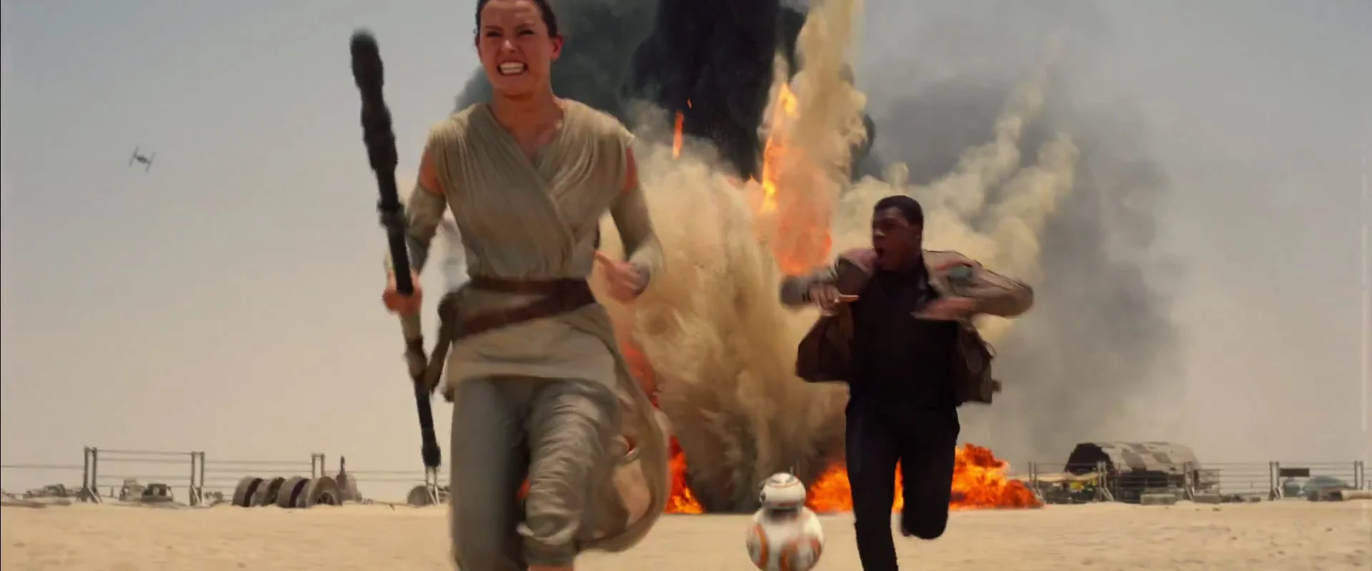 Rey, BB-8, and Finn under attack from a Tie Fighter