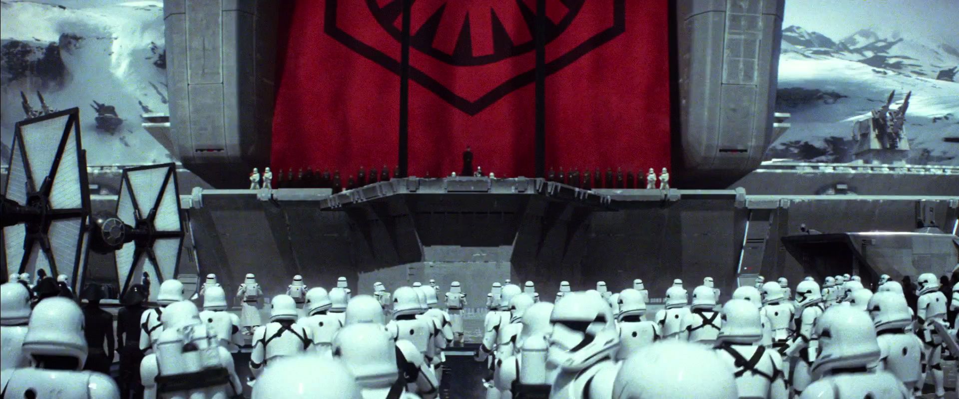 The Empire also has a new name "The First Order." They also have a new symbol. Who ever is on stage must be important. Lots of speculation on who it is but It's all guesses. On the left side a black Tie Fighter with white panels that some are calling Inverted Ties or Stealth Ties; I'm just going to call them New Ties until we know for sure.