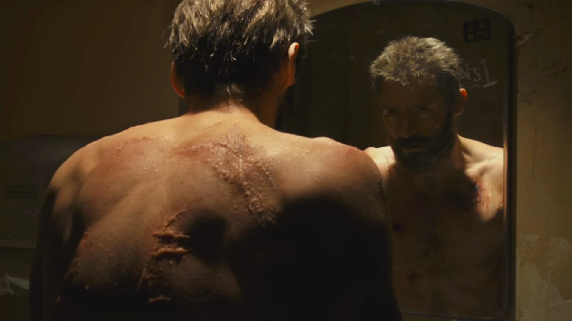 Explanation of Why Wolverine Has Scars in LOGAN and Why Johnny Cash's