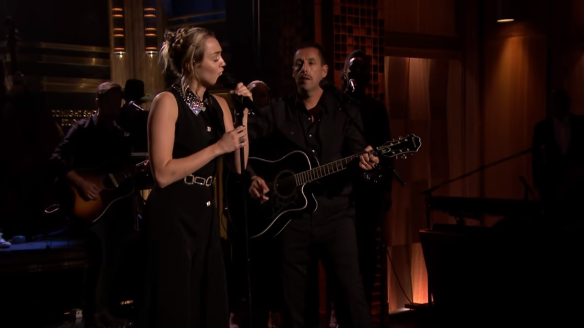 Watch Adam Sandler And Miley Cyrus Perform "No Freedom" In Response To