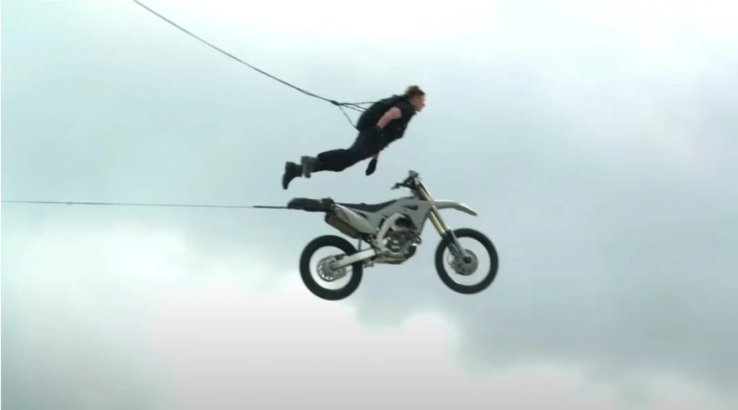 Tom Cruise explains the practical reason why they shot the most dangerous stunt of his career on the first day of M:I – 7 Shoot